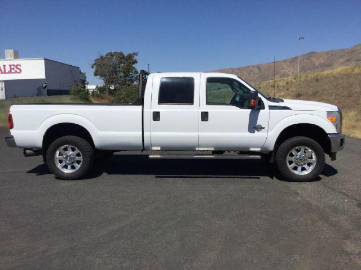 2012 Oxford White Ford F-350 SD CREW CAB PICKUP 4-DR (1FT8W3BT9CE) with an 6.7L V8 OHV 16V DIESEL engine, 6-Speed Automatic transmission, located at 1801 Main Street, Lewiston, 83501, (208) 743-9371, 46.417065, -117.004799 - Photo#16