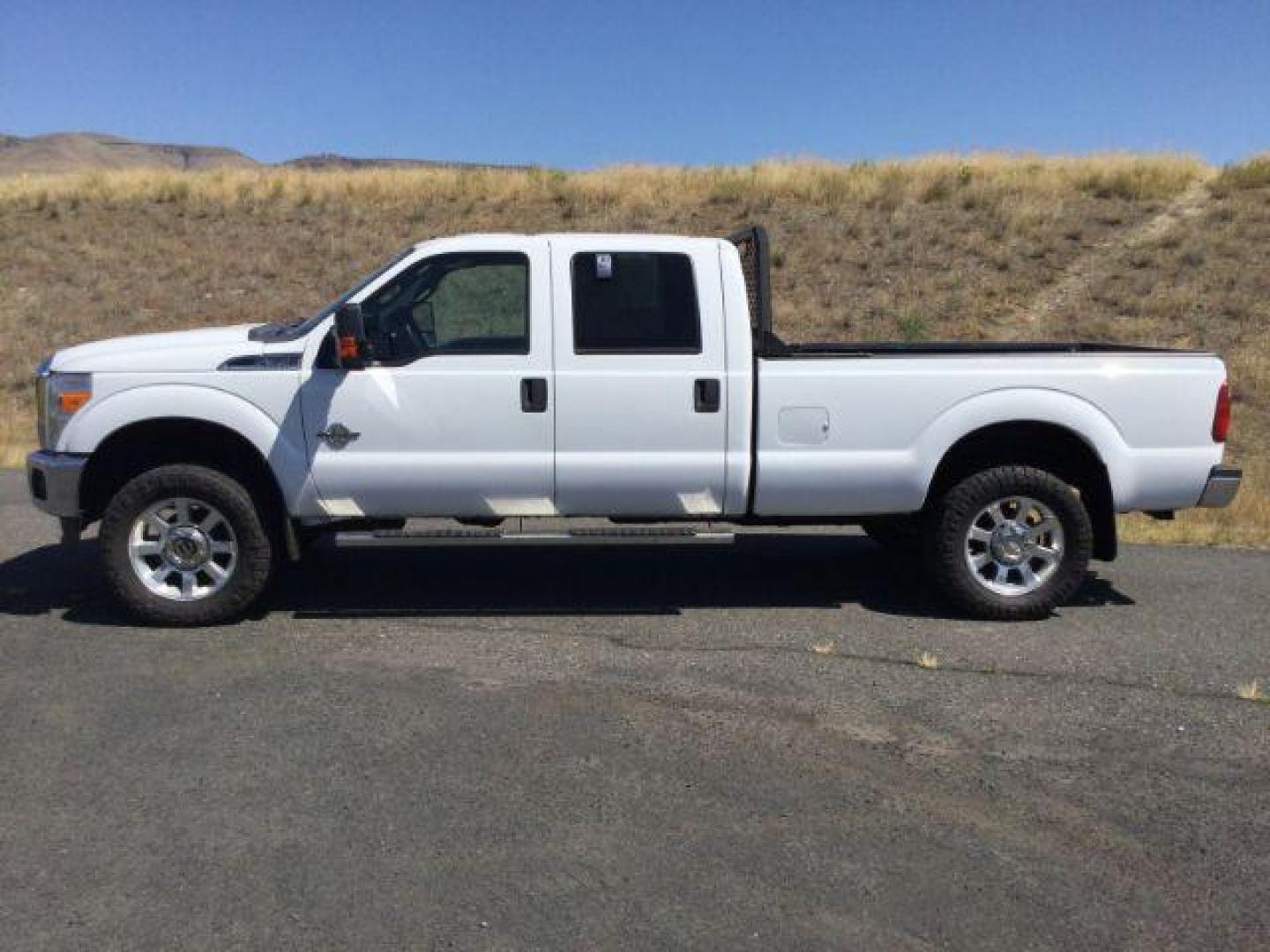 2012 Oxford White Ford F-350 SD CREW CAB PICKUP 4-DR (1FT8W3BT9CE) with an 6.7L V8 OHV 16V DIESEL engine, 6-Speed Automatic transmission, located at 1801 Main Street, Lewiston, 83501, (208) 743-9371, 46.417065, -117.004799 - Photo#1