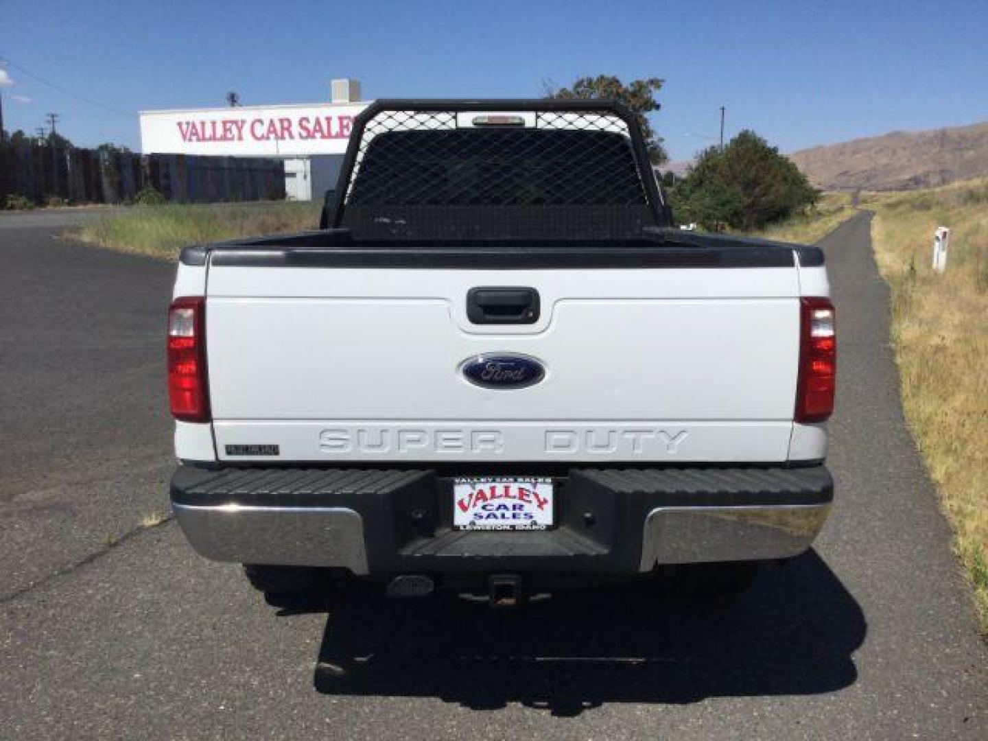 2012 Oxford White Ford F-350 SD CREW CAB PICKUP 4-DR (1FT8W3BT9CE) with an 6.7L V8 OHV 16V DIESEL engine, 6-Speed Automatic transmission, located at 1801 Main Street, Lewiston, 83501, (208) 743-9371, 46.417065, -117.004799 - Photo#5