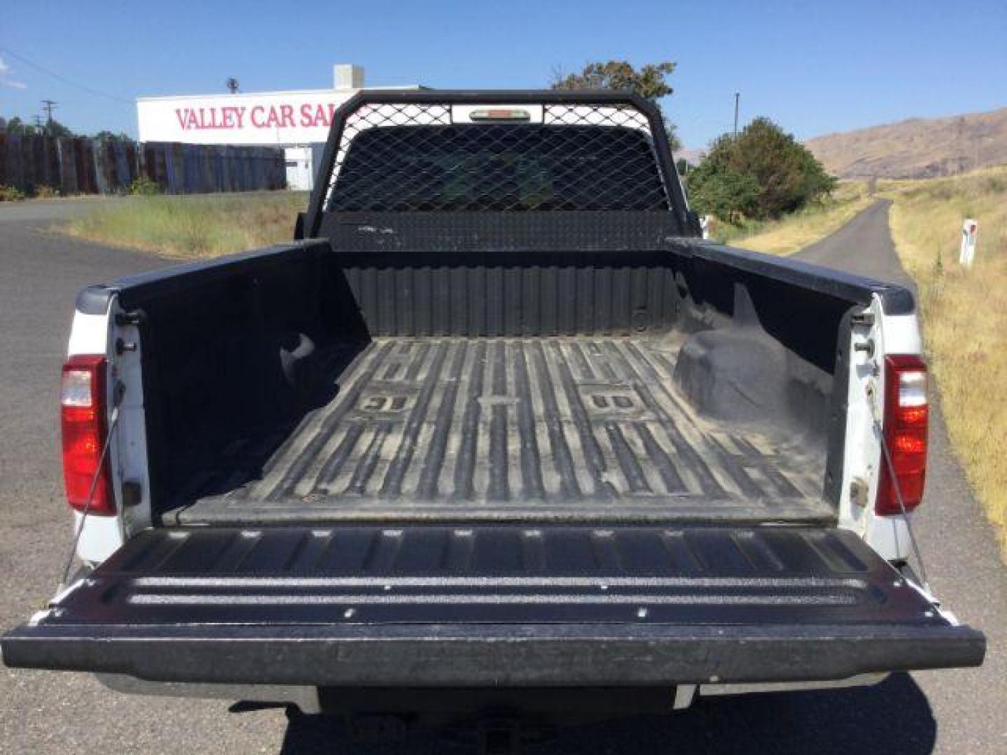 2012 Oxford White Ford F-350 SD CREW CAB PICKUP 4-DR (1FT8W3BT9CE) with an 6.7L V8 OHV 16V DIESEL engine, 6-Speed Automatic transmission, located at 1801 Main Street, Lewiston, 83501, (208) 743-9371, 46.417065, -117.004799 - Photo#6