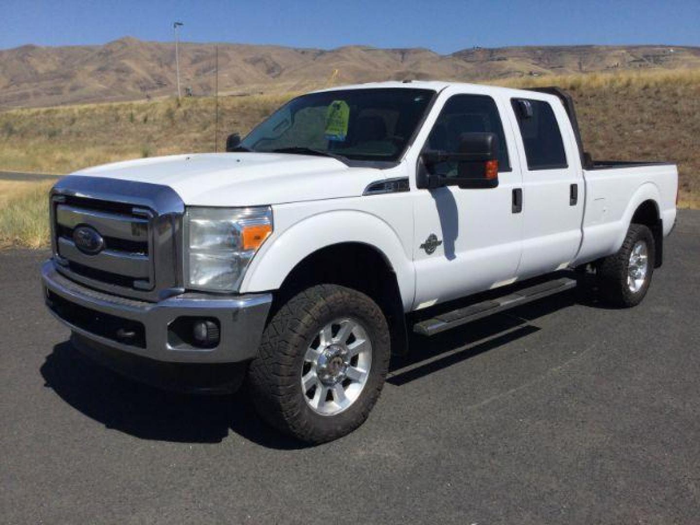 2012 Oxford White Ford F-350 SD CREW CAB PICKUP 4-DR (1FT8W3BT9CE) with an 6.7L V8 OHV 16V DIESEL engine, 6-Speed Automatic transmission, located at 1801 Main Street, Lewiston, 83501, (208) 743-9371, 46.417065, -117.004799 - Photo#7