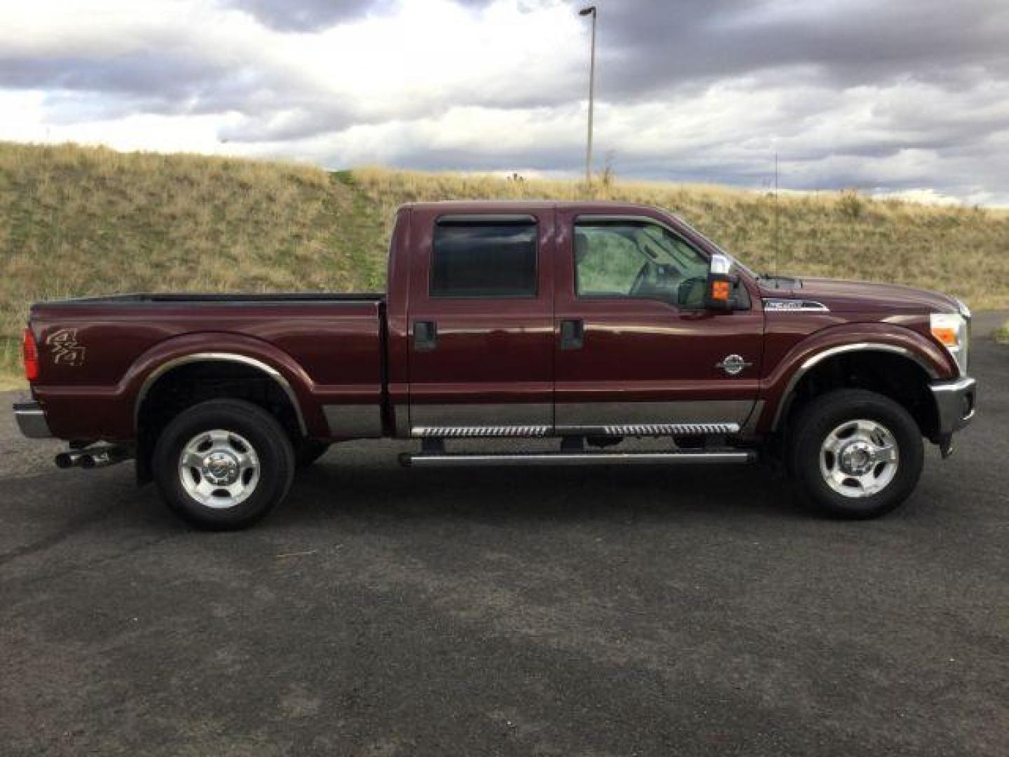 2011 Royal Red Metallic /Adobe Cloth Interior Ford F-350 SD XLT Crew Cab 4WD (1FT8W3BT2BE) with an 6.7L V8 OHV 16V DIESEL engine, 6-Speed Automatic transmission, located at 1801 Main Street, Lewiston, 83501, (208) 743-9371, 46.417065, -117.004799 - Photo#14