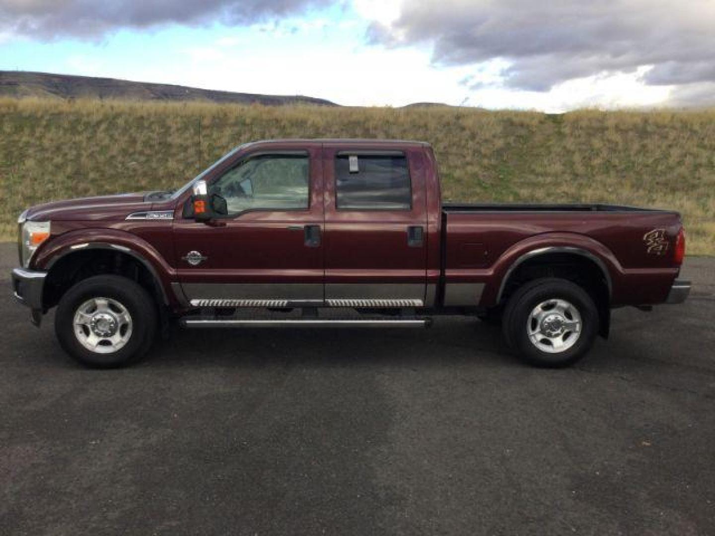 2011 Royal Red Metallic /Adobe Cloth Interior Ford F-350 SD XLT Crew Cab 4WD (1FT8W3BT2BE) with an 6.7L V8 OHV 16V DIESEL engine, 6-Speed Automatic transmission, located at 1801 Main Street, Lewiston, 83501, (208) 743-9371, 46.417065, -117.004799 - Photo#1