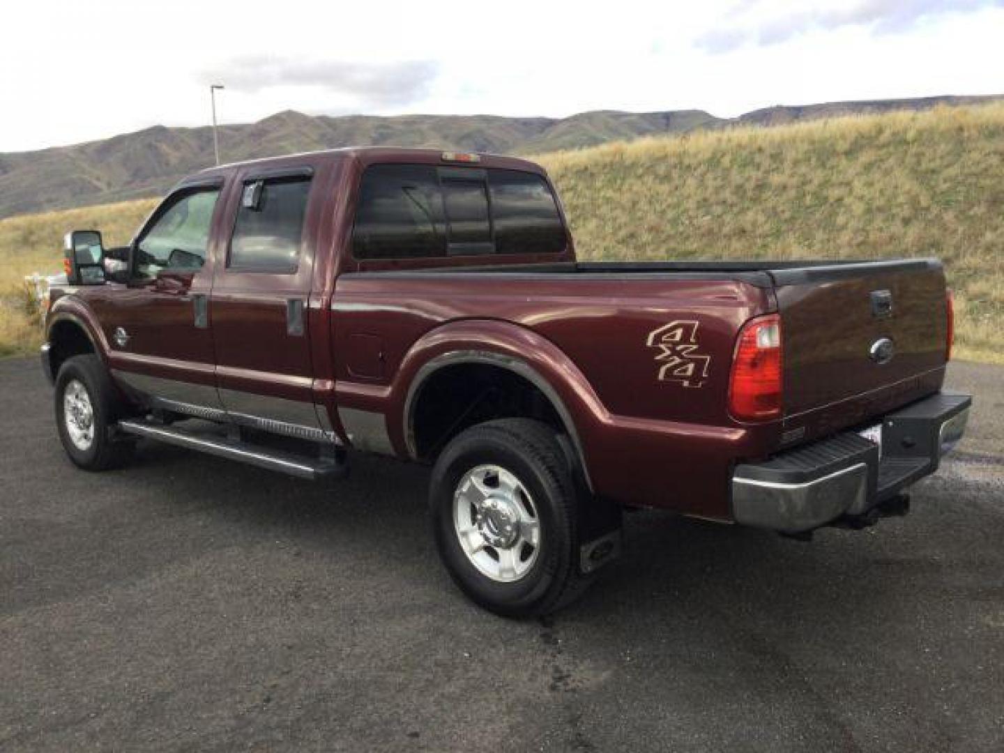 2011 Royal Red Metallic /Adobe Cloth Interior Ford F-350 SD XLT Crew Cab 4WD (1FT8W3BT2BE) with an 6.7L V8 OHV 16V DIESEL engine, 6-Speed Automatic transmission, located at 1801 Main Street, Lewiston, 83501, (208) 743-9371, 46.417065, -117.004799 - Photo#2