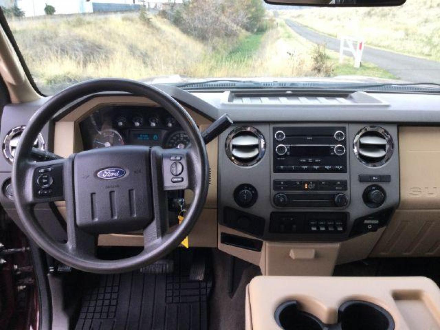 2011 Royal Red Metallic /Adobe Cloth Interior Ford F-350 SD XLT Crew Cab 4WD (1FT8W3BT2BE) with an 6.7L V8 OHV 16V DIESEL engine, 6-Speed Automatic transmission, located at 1801 Main Street, Lewiston, 83501, (208) 743-9371, 46.417065, -117.004799 - Photo#6