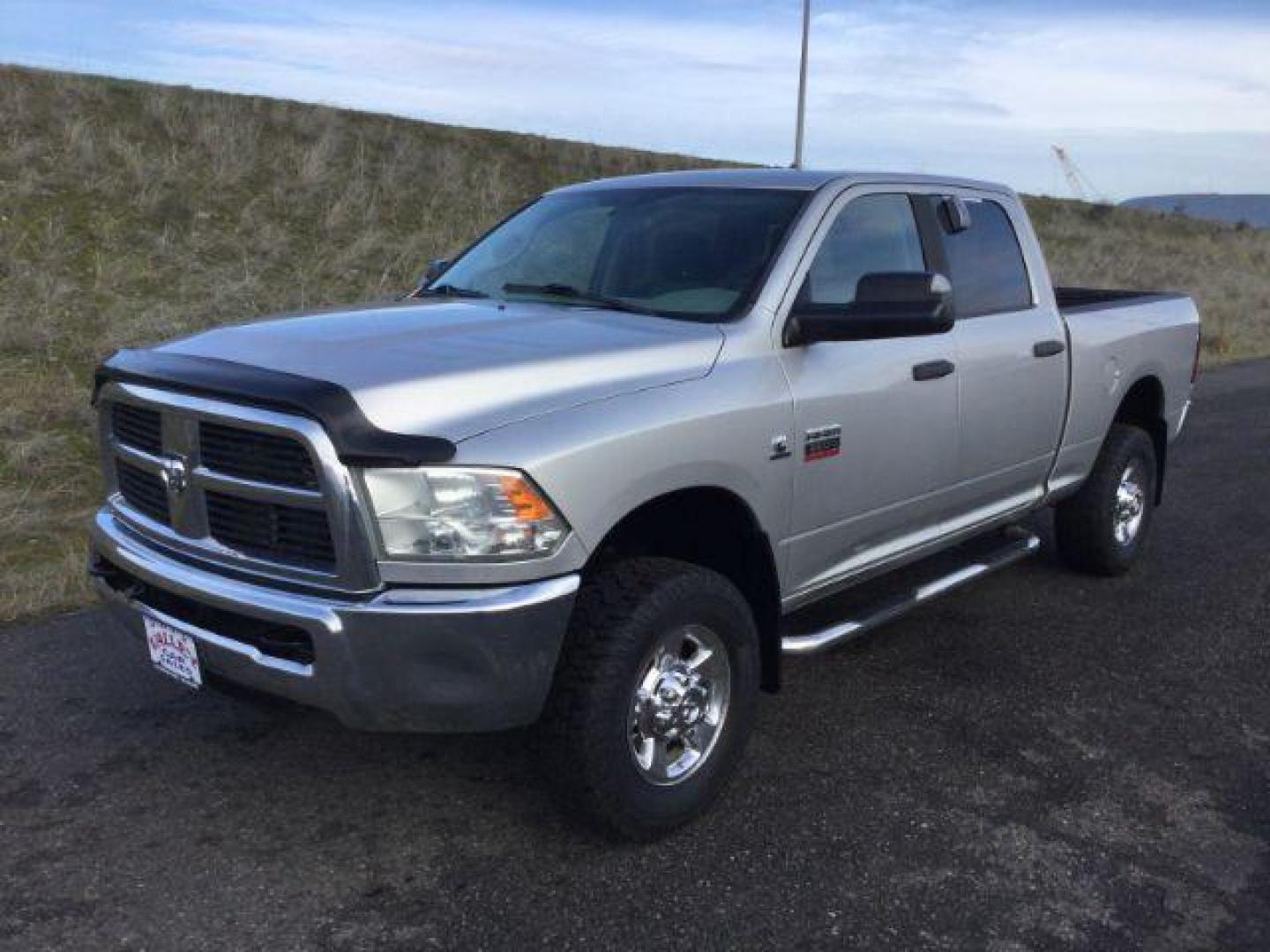 2012 Bright Silver Metallic /Dark Slate/Medium Graystone Cloth Interior RAM 3500 SLT Crew Cab SWB 4WD (3C63D3DL6CG) with an 6.7L L6 OHV 24V TURBO DIESEL engine, 6-Speed Automatic transmission, located at 1801 Main Street, Lewiston, 83501, (208) 743-9371, 46.417065, -117.004799 - Photo#0