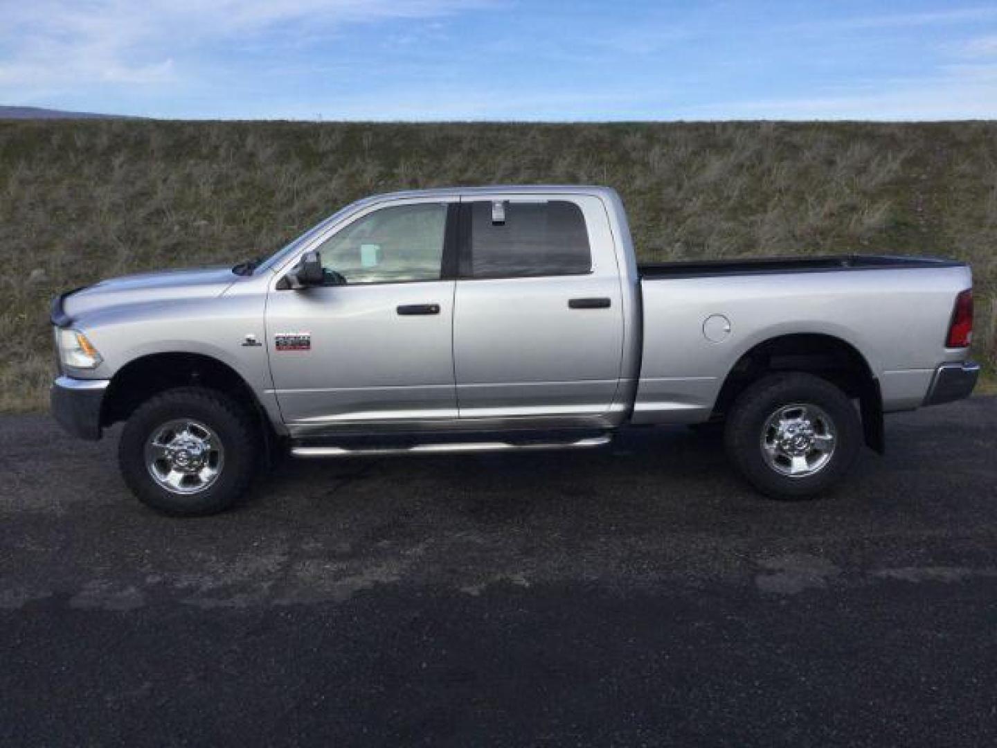 2012 Bright Silver Metallic /Dark Slate/Medium Graystone Cloth Interior RAM 3500 SLT Crew Cab SWB 4WD (3C63D3DL6CG) with an 6.7L L6 OHV 24V TURBO DIESEL engine, 6-Speed Automatic transmission, located at 1801 Main Street, Lewiston, 83501, (208) 743-9371, 46.417065, -117.004799 - Photo#1