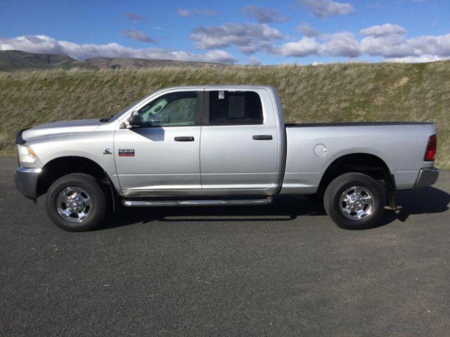 2012 Bright Silver Metallic /Dark Slate/Medium Graystone Cloth Interior RAM 3500 SLT Crew Cab SWB 4WD (3C63D3DL6CG) with an 6.7L L6 OHV 24V TURBO DIESEL engine, 6-Speed Automatic transmission, located at 1801 Main Street, Lewiston, 83501, (208) 743-9371, 46.417065, -117.004799 - Photo#1