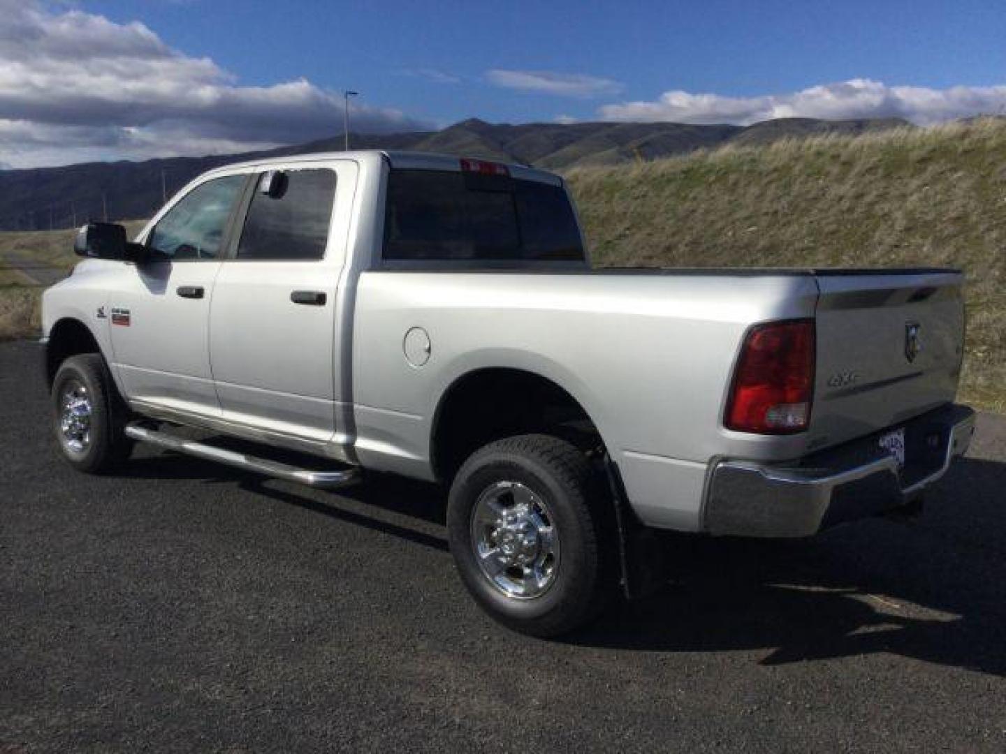 2012 Bright Silver Metallic /Dark Slate/Medium Graystone Cloth Interior RAM 3500 SLT Crew Cab SWB 4WD (3C63D3DL6CG) with an 6.7L L6 OHV 24V TURBO DIESEL engine, 6-Speed Automatic transmission, located at 1801 Main Street, Lewiston, 83501, (208) 743-9371, 46.417065, -117.004799 - Photo#2