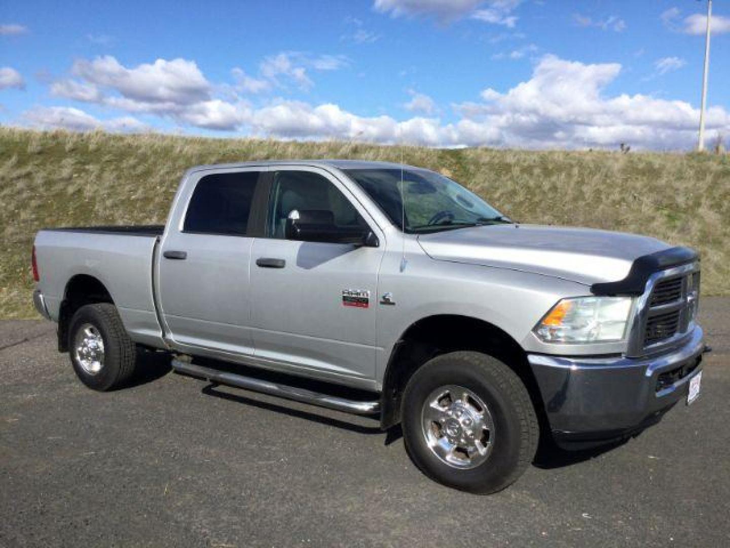 2012 Bright Silver Metallic /Dark Slate/Medium Graystone Cloth Interior RAM 3500 SLT Crew Cab SWB 4WD (3C63D3DL6CG) with an 6.7L L6 OHV 24V TURBO DIESEL engine, 6-Speed Automatic transmission, located at 1801 Main Street, Lewiston, 83501, (208) 743-9371, 46.417065, -117.004799 - Photo#10