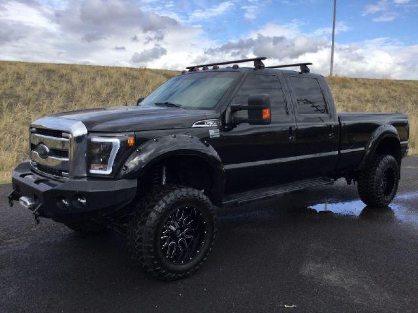 2014 Tuxedo Black Metallic /Black Ford F-350 SD Lariat Crew Cab 4WD (1FT8W3BT8EE) with an 6.7L V8 OHV 16V DIESEL engine, 6-Speed Automatic transmission, located at 1801 Main Street, Lewiston, 83501, (208) 743-9371, 46.417065, -117.004799 - Photo#0