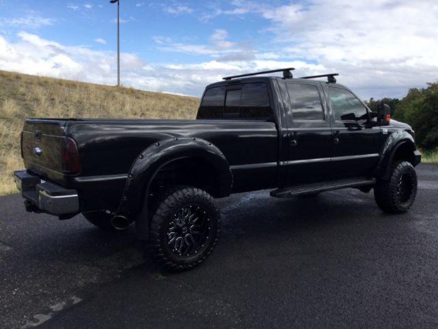 2014 Tuxedo Black Metallic /Black Ford F-350 SD Lariat Crew Cab 4WD (1FT8W3BT8EE) with an 6.7L V8 OHV 16V DIESEL engine, 6-Speed Automatic transmission, located at 1801 Main Street, Lewiston, 83501, (208) 743-9371, 46.417065, -117.004799 - Photo#14