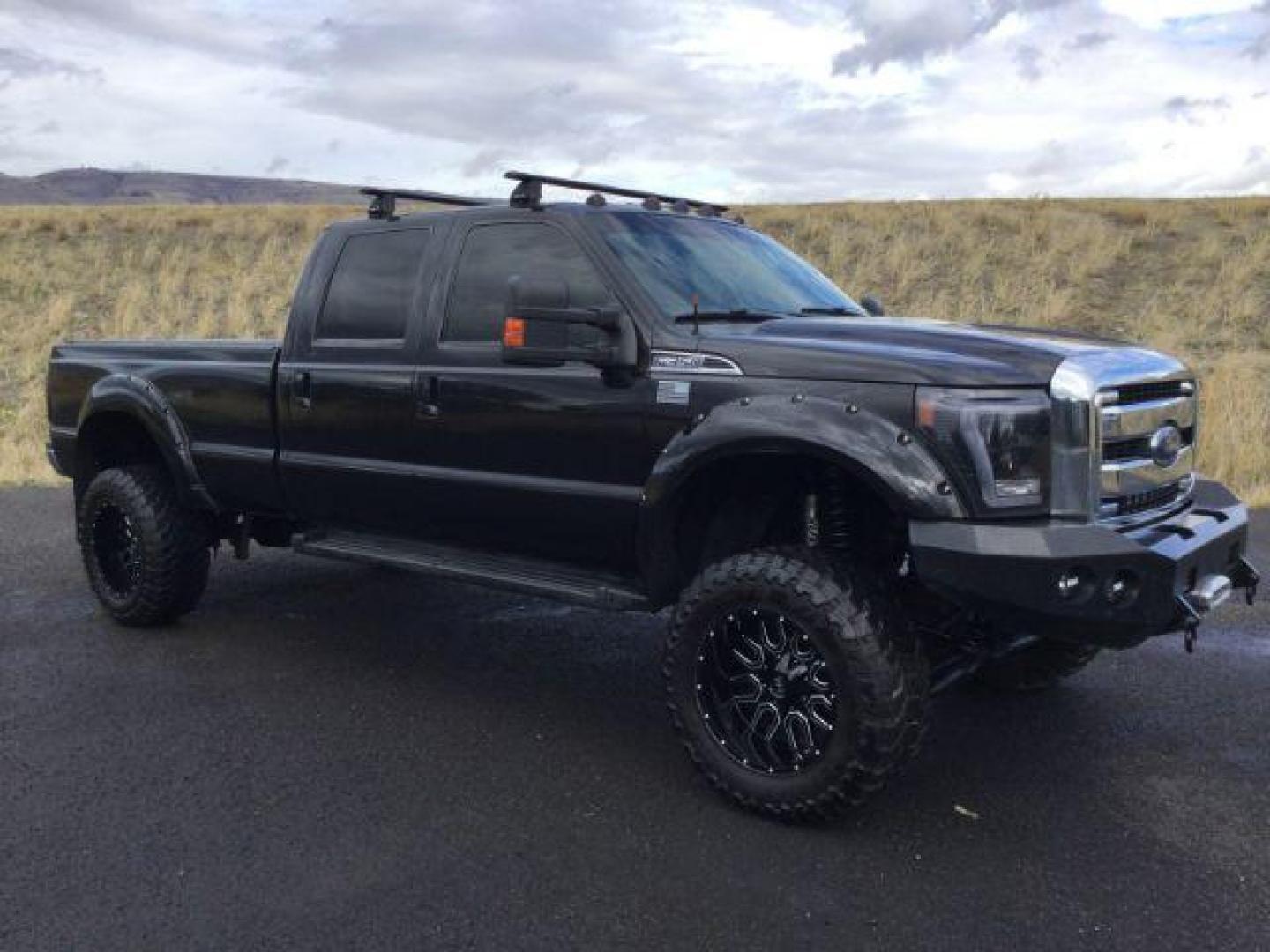 2014 Tuxedo Black Metallic /Black Ford F-350 SD Lariat Crew Cab 4WD (1FT8W3BT8EE) with an 6.7L V8 OHV 16V DIESEL engine, 6-Speed Automatic transmission, located at 1801 Main Street, Lewiston, 83501, (208) 743-9371, 46.417065, -117.004799 - Photo#16