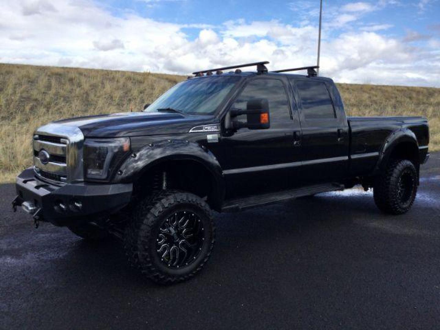 2014 Tuxedo Black Metallic /Black Ford F-350 SD Lariat Crew Cab 4WD (1FT8W3BT8EE) with an 6.7L V8 OHV 16V DIESEL engine, 6-Speed Automatic transmission, located at 1801 Main Street, Lewiston, 83501, (208) 743-9371, 46.417065, -117.004799 - Photo#18