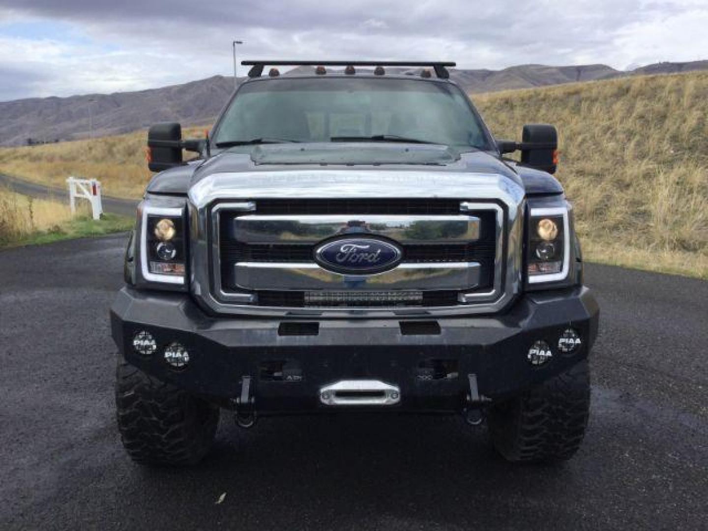 2014 Tuxedo Black Metallic /Black Ford F-350 SD Lariat Crew Cab 4WD (1FT8W3BT8EE) with an 6.7L V8 OHV 16V DIESEL engine, 6-Speed Automatic transmission, located at 1801 Main Street, Lewiston, 83501, (208) 743-9371, 46.417065, -117.004799 - Photo#21