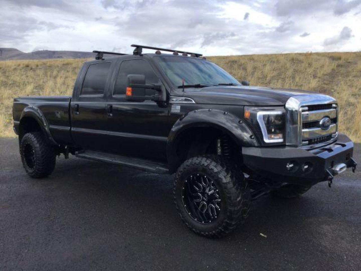 2014 Tuxedo Black Metallic /Black Ford F-350 SD Lariat Crew Cab 4WD (1FT8W3BT8EE) with an 6.7L V8 OHV 16V DIESEL engine, 6-Speed Automatic transmission, located at 1801 Main Street, Lewiston, 83501, (208) 743-9371, 46.417065, -117.004799 - Photo#22