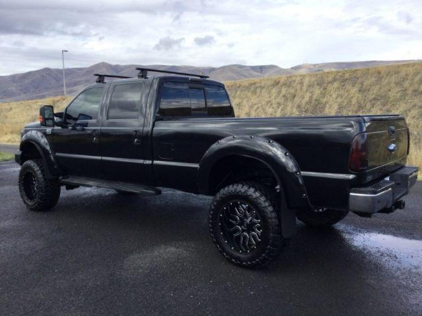 2014 Tuxedo Black Metallic /Black Ford F-350 SD Lariat Crew Cab 4WD (1FT8W3BT8EE) with an 6.7L V8 OHV 16V DIESEL engine, 6-Speed Automatic transmission, located at 1801 Main Street, Lewiston, 83501, (208) 743-9371, 46.417065, -117.004799 - Photo#2