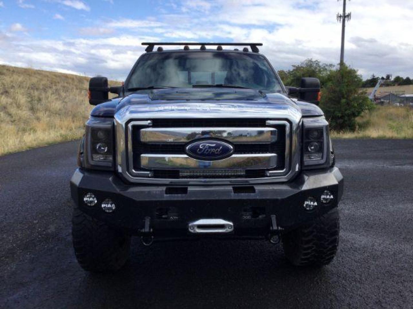 2014 Tuxedo Black Metallic /Black Ford F-350 SD Lariat Crew Cab 4WD (1FT8W3BT8EE) with an 6.7L V8 OHV 16V DIESEL engine, 6-Speed Automatic transmission, located at 1801 Main Street, Lewiston, 83501, (208) 743-9371, 46.417065, -117.004799 - Photo#6