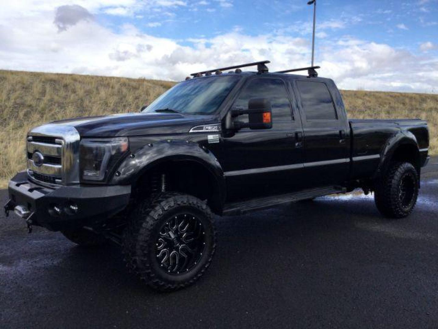 2014 Tuxedo Black Metallic /Black Ford F-350 SD Lariat Crew Cab 4WD (1FT8W3BT8EE) with an 6.7L V8 OHV 16V DIESEL engine, 6-Speed Automatic transmission, located at 1801 Main Street, Lewiston, 83501, (208) 743-9371, 46.417065, -117.004799 - Photo#7