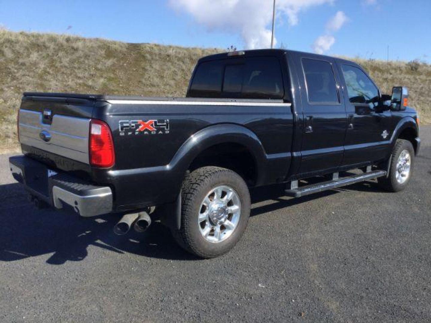 2011 Tuxedo Black Metallic /Black Leather Interior Ford F-350 SD Lariat Crew Cab 4WD (1FT8W3BTXBE) with an 6.7L V8 OHV 16V DIESEL engine, 6-Speed Automatic transmission, located at 1801 Main Street, Lewiston, 83501, (208) 743-9371, 46.417065, -117.004799 - Photo#9