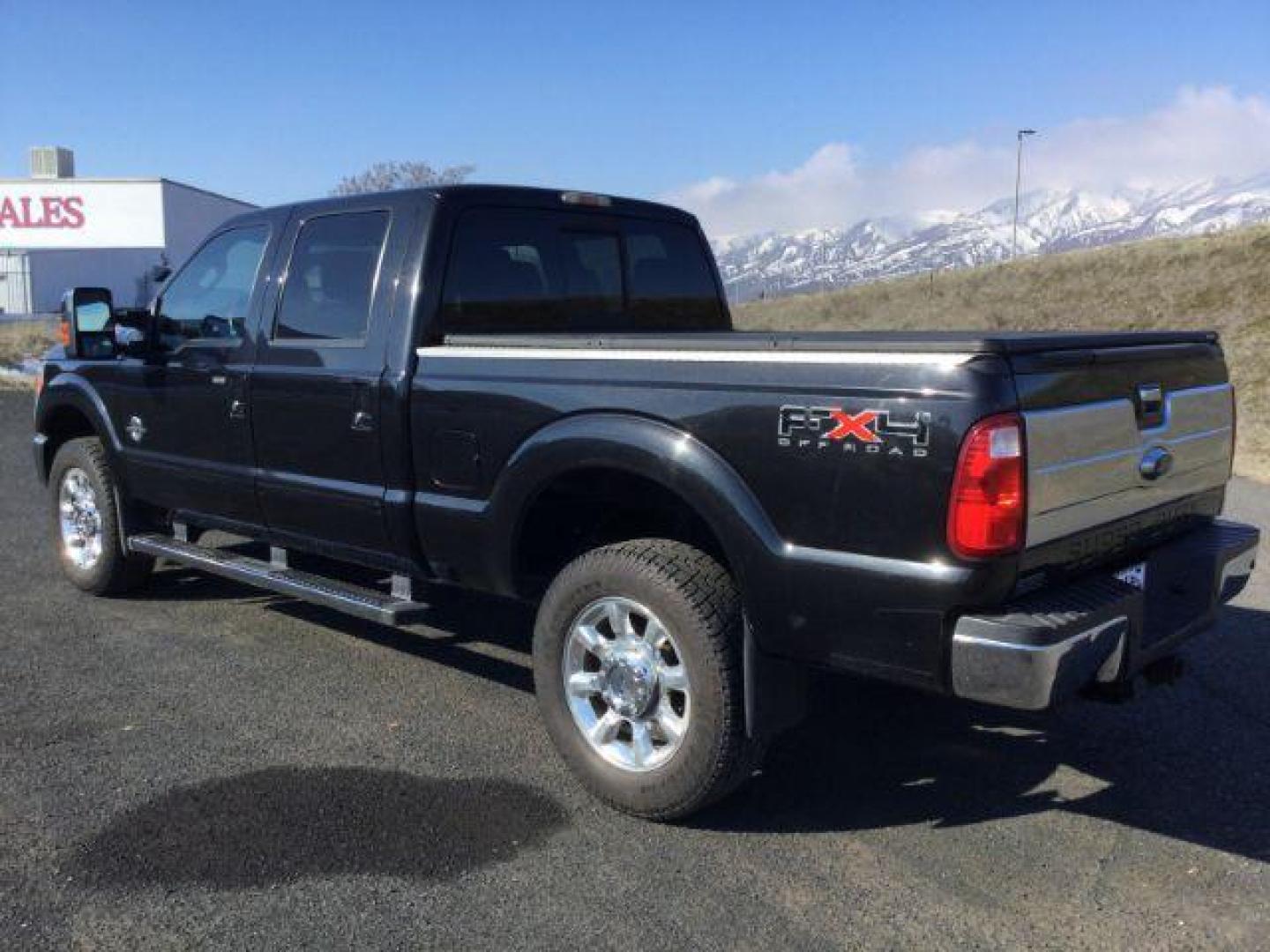 2011 Tuxedo Black Metallic /Black Leather Interior Ford F-350 SD Lariat Crew Cab 4WD (1FT8W3BTXBE) with an 6.7L V8 OHV 16V DIESEL engine, 6-Speed Automatic transmission, located at 1801 Main Street, Lewiston, 83501, (208) 743-9371, 46.417065, -117.004799 - Photo#2