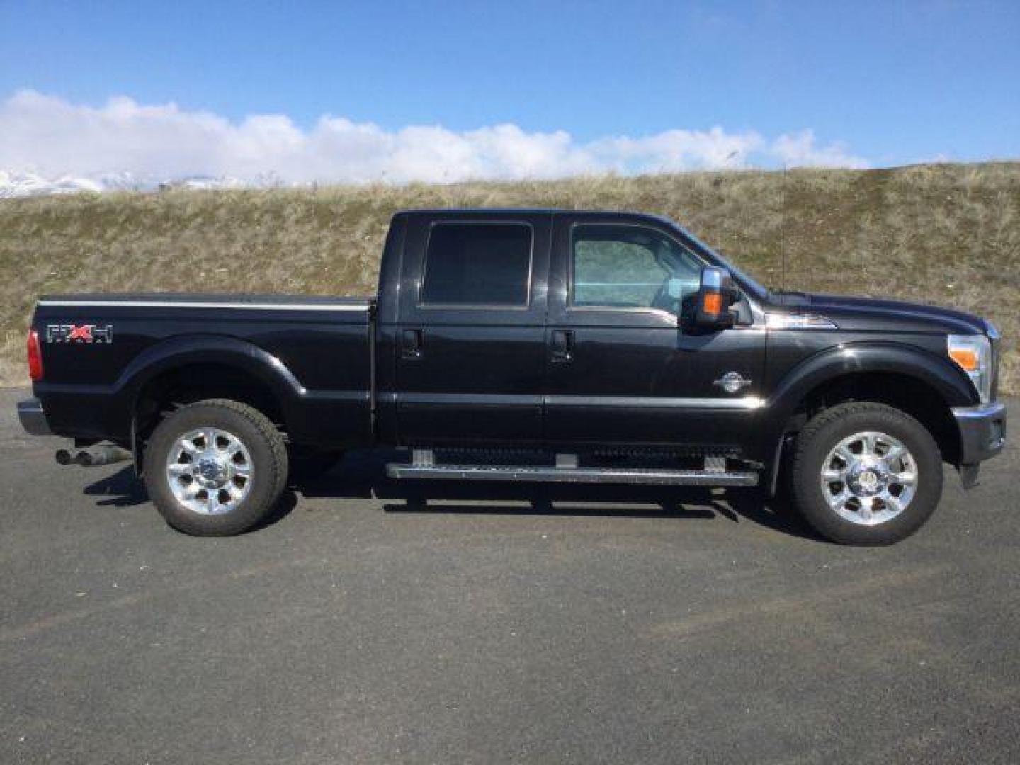 2011 Tuxedo Black Metallic /Black Leather Interior Ford F-350 SD Lariat Crew Cab 4WD (1FT8W3BTXBE) with an 6.7L V8 OHV 16V DIESEL engine, 6-Speed Automatic transmission, located at 1801 Main Street, Lewiston, 83501, (208) 743-9371, 46.417065, -117.004799 - Photo#8