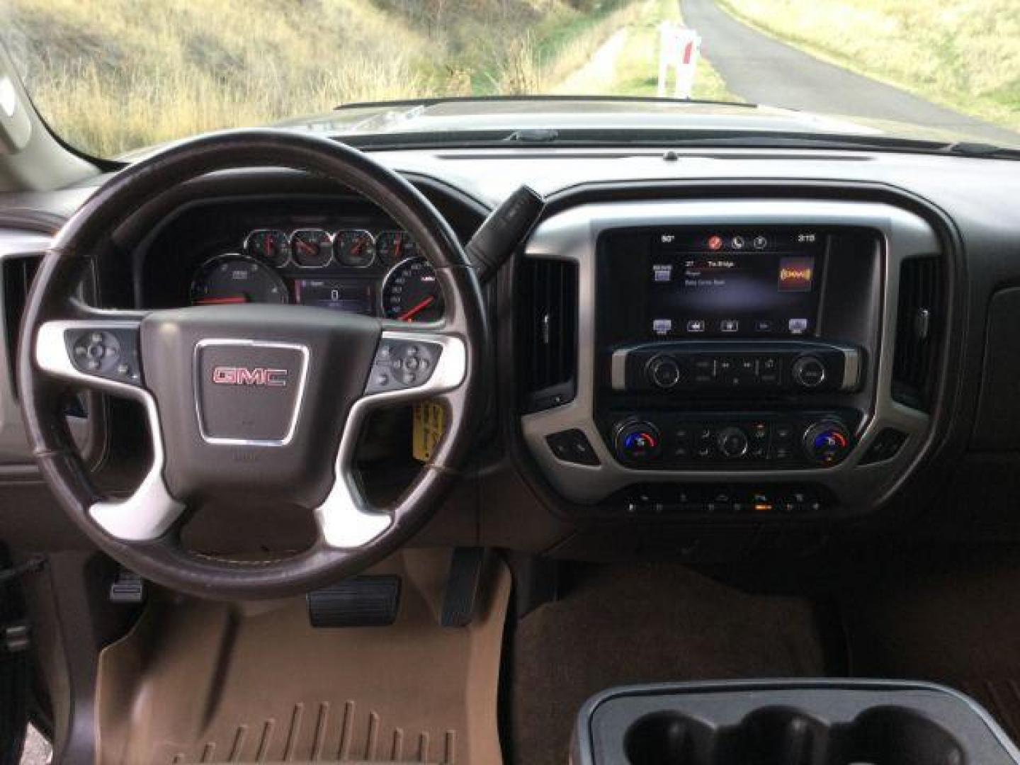 2015 Bronze Alloy Metallic /Cocoa/Dune GMC Sierra 3500HD SLT Crew Cab 4WD (1GT423E82FF) with an 6.6L V8 OHV 16 DIESEL engine, 6-Speed Automatic transmission, located at 1801 Main Street, Lewiston, 83501, (208) 743-9371, 46.417065, -117.004799 - Photo#11