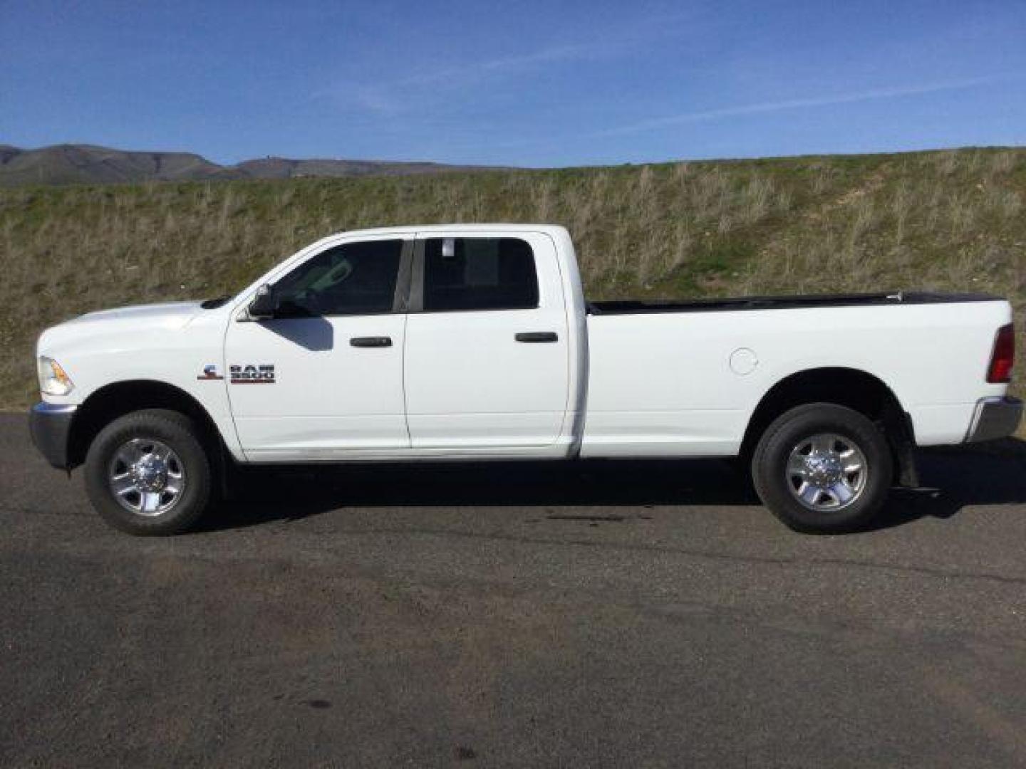 2015 Bright White Clear Coat /Black/Diesel Gray, cloth RAM 3500 SLT Crew Cab LWB 4WD (3C63R3HL2FG) with an 6.7L L6 OHV 24V TURBO DIESEL engine, 6-Speed Automatic transmission, located at 1801 Main Street, Lewiston, 83501, (208) 743-9371, 46.417065, -117.004799 - Photo#1