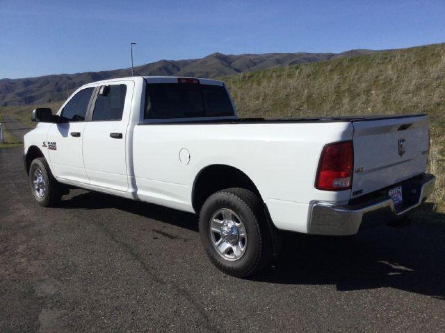 2015 Bright White Clear Coat /Black/Diesel Gray, cloth RAM 3500 SLT Crew Cab LWB 4WD (3C63R3HL2FG) with an 6.7L L6 OHV 24V TURBO DIESEL engine, 6-Speed Automatic transmission, located at 1801 Main Street, Lewiston, 83501, (208) 743-9371, 46.417065, -117.004799 - Photo#2