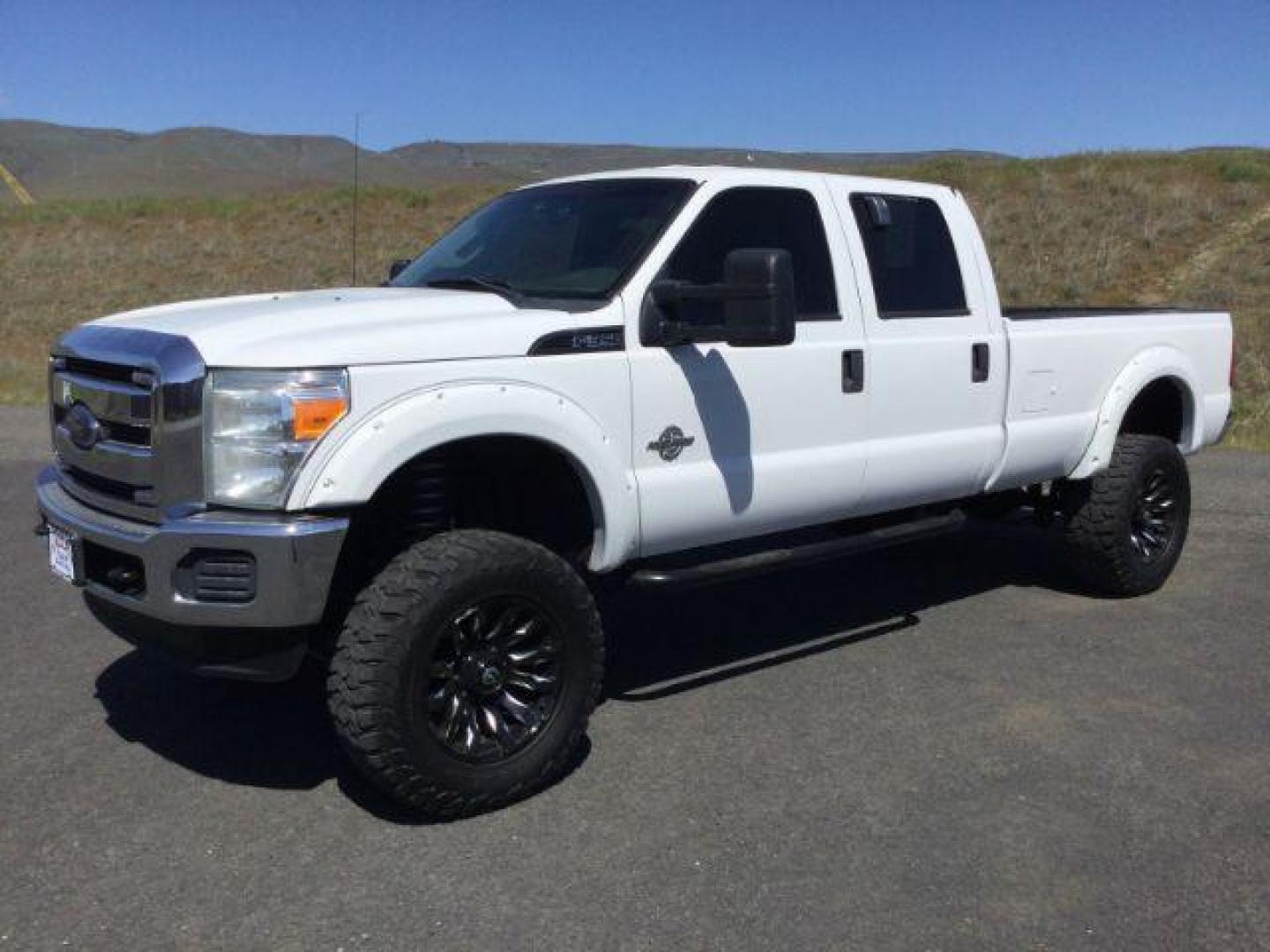 2012 Oxford White /Steel Cloth Interior Ford F-350 SD XL Crew Cab Long Bed 4WD (1FT8W3BT0CE) with an 6.7L V8 OHV 16V DIESEL engine, 6-Speed Automatic transmission, located at 1801 Main Street, Lewiston, 83501, (208) 743-9371, 46.417065, -117.004799 - Photo#0