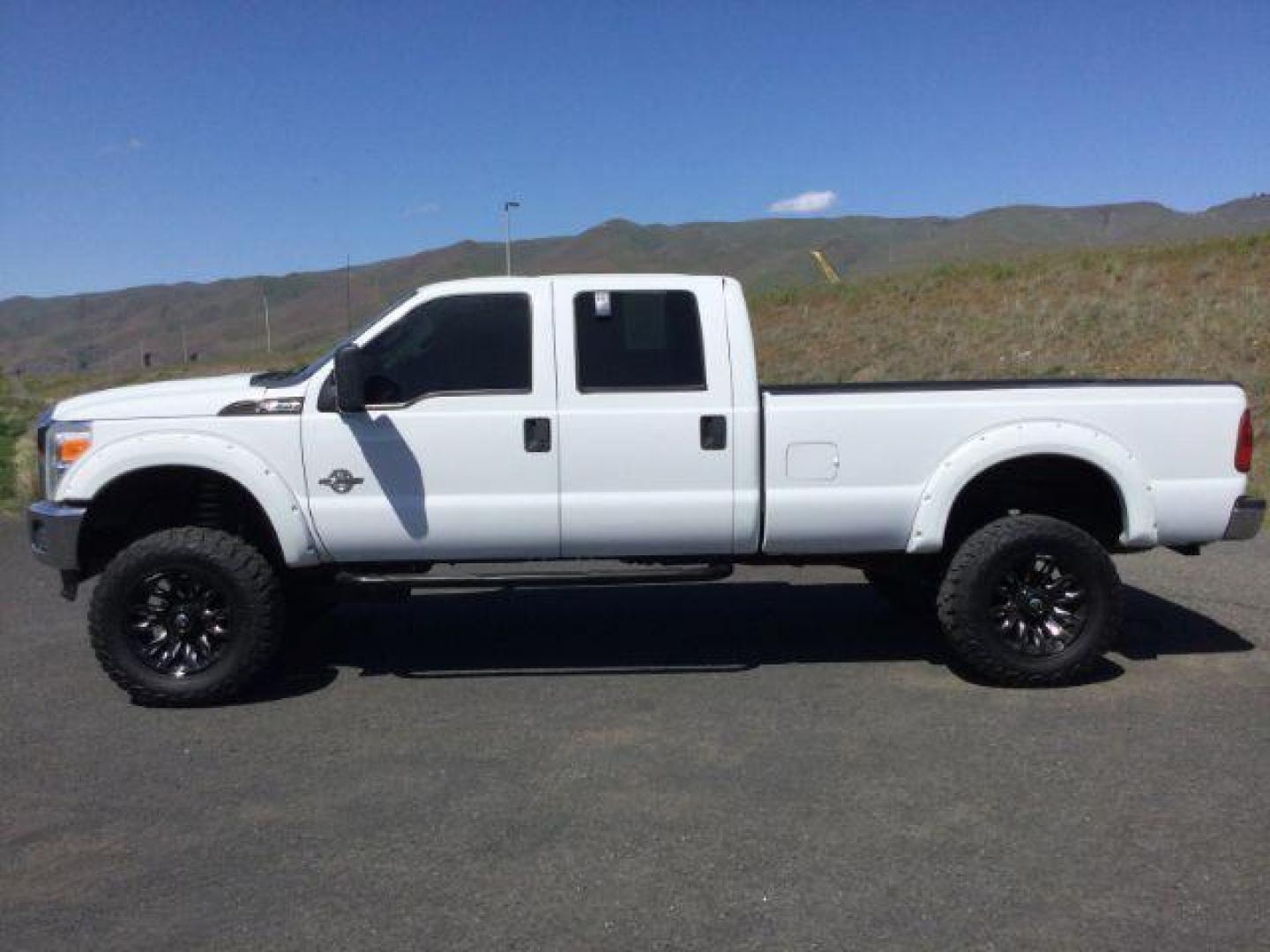 2012 Oxford White /Steel Cloth Interior Ford F-350 SD XL Crew Cab Long Bed 4WD (1FT8W3BT0CE) with an 6.7L V8 OHV 16V DIESEL engine, 6-Speed Automatic transmission, located at 1801 Main Street, Lewiston, 83501, (208) 743-9371, 46.417065, -117.004799 - Photo#1