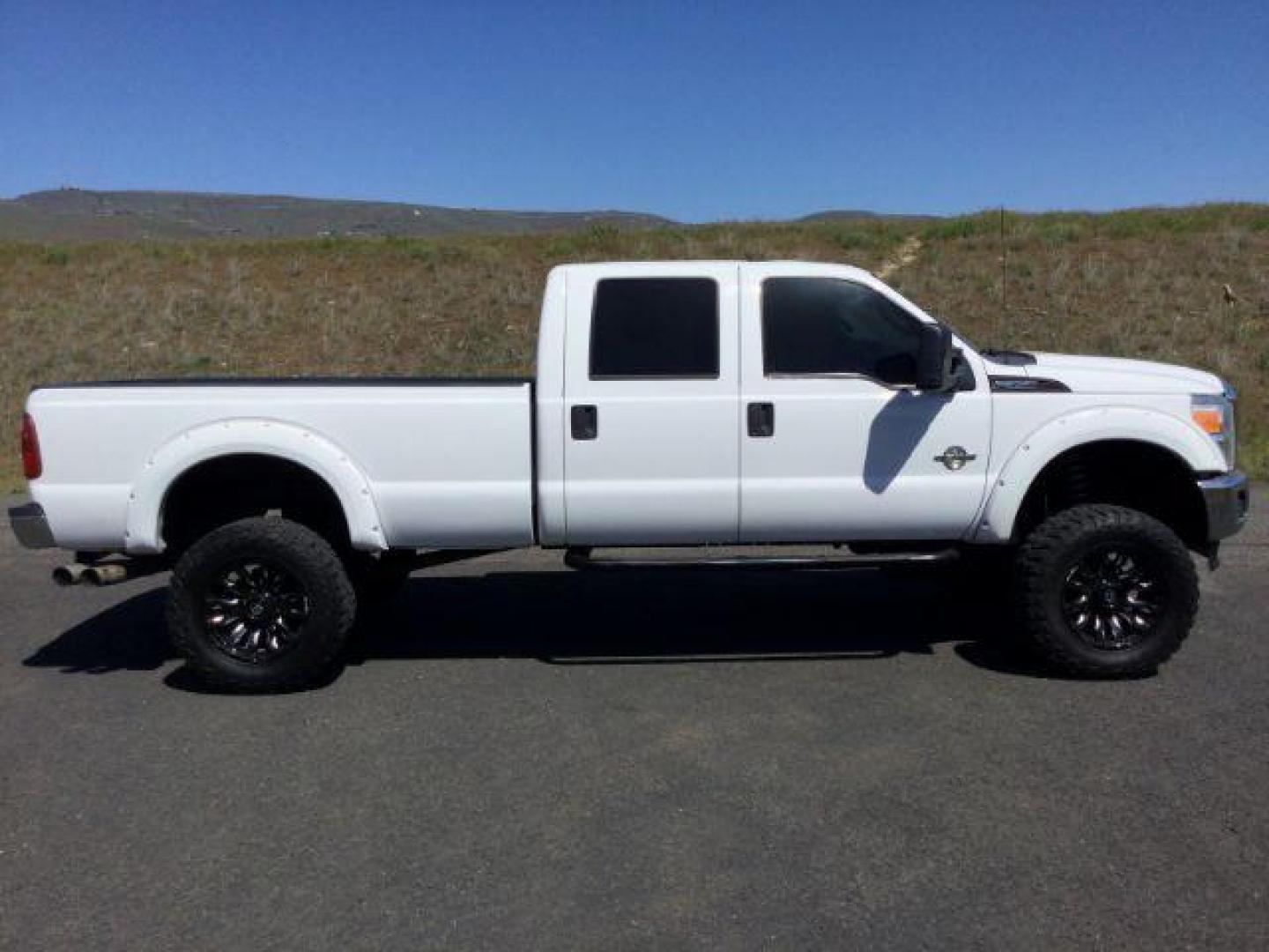 2012 Oxford White /Steel Cloth Interior Ford F-350 SD XL Crew Cab Long Bed 4WD (1FT8W3BT0CE) with an 6.7L V8 OHV 16V DIESEL engine, 6-Speed Automatic transmission, located at 1801 Main Street, Lewiston, 83501, (208) 743-9371, 46.417065, -117.004799 - Photo#7