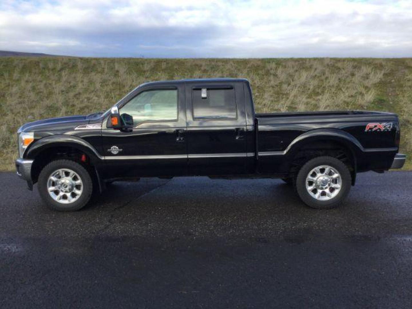 2016 BLACK Ford F-350 SD Lariat Crew Cab 4WD (1FT8W3BTXGE) with an 6.7L V8 OHV 16V DIESEL engine, 6-Speed Automatic transmission, located at 1801 Main Street, Lewiston, 83501, (208) 743-9371, 46.417065, -117.004799 - Photo#1