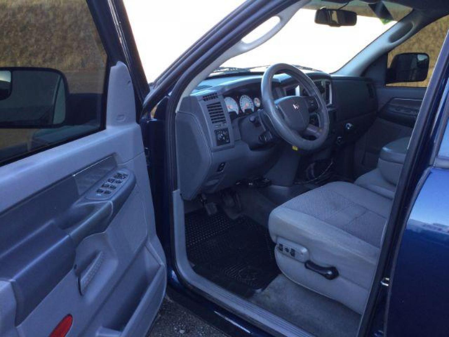 2007 Patriot Blue Pearlcoat /Medium Slate Gray Cloth Interior Dodge Ram 3500 SLT Quad Cab LWB 4X4 (3D7MX38C57G) with an 5.9L L6 OHV 24V TURBO DIESEL engine, 6-Speed Manual transmission, located at 1801 Main Street, Lewiston, 83501, (208) 743-9371, 46.417065, -117.004799 - Photo#3