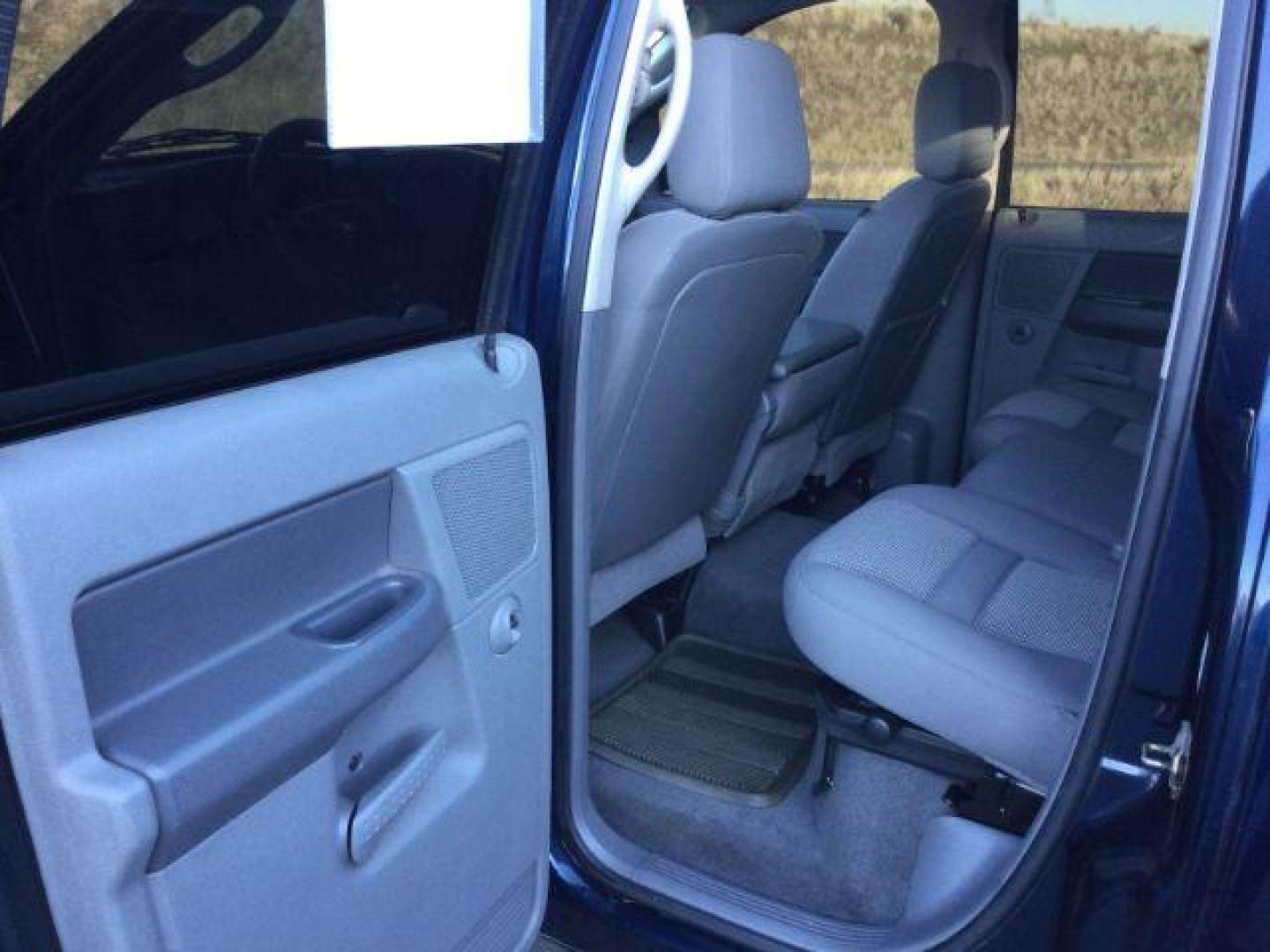 2007 Patriot Blue Pearlcoat /Medium Slate Gray Cloth Interior Dodge Ram 3500 SLT Quad Cab LWB 4X4 (3D7MX38C57G) with an 5.9L L6 OHV 24V TURBO DIESEL engine, 6-Speed Manual transmission, located at 1801 Main Street, Lewiston, 83501, (208) 743-9371, 46.417065, -117.004799 - Photo#5