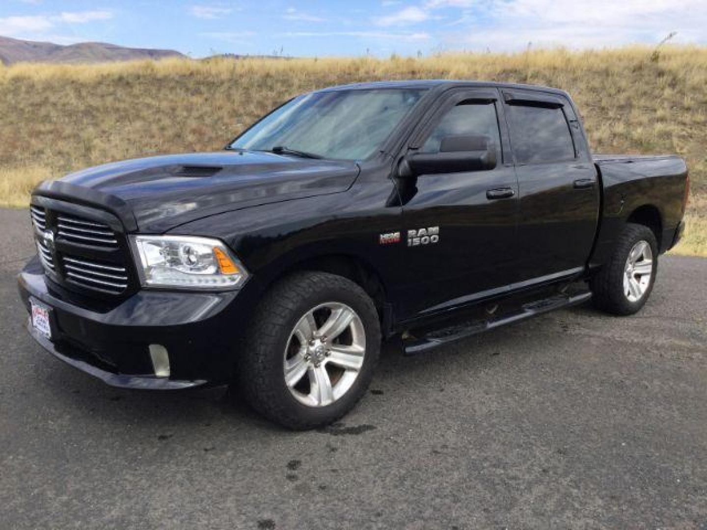 2014 Black Clearcoat /Black RAM 1500 Sport Crew Cab SWB 4WD (1C6RR7MT4ES) with an 5.7L V8 OHV 16V engine, 8-Speed Automatic transmission, located at 1801 Main Street, Lewiston, 83501, (208) 743-9371, 46.417065, -117.004799 - Photo#0