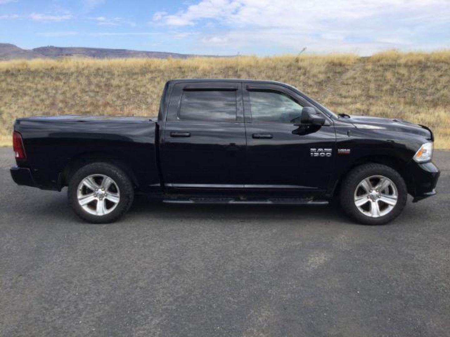 2014 Black Clearcoat /Black RAM 1500 Sport Crew Cab SWB 4WD (1C6RR7MT4ES) with an 5.7L V8 OHV 16V engine, 8-Speed Automatic transmission, located at 1801 Main Street, Lewiston, 83501, (208) 743-9371, 46.417065, -117.004799 - Photo#9