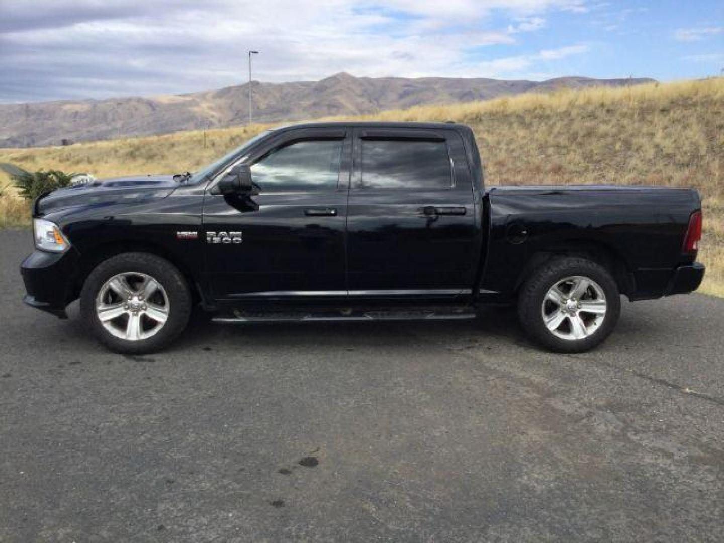 2014 Black Clearcoat /Black RAM 1500 Sport Crew Cab SWB 4WD (1C6RR7MT4ES) with an 5.7L V8 OHV 16V engine, 8-Speed Automatic transmission, located at 1801 Main Street, Lewiston, 83501, (208) 743-9371, 46.417065, -117.004799 - Photo#1