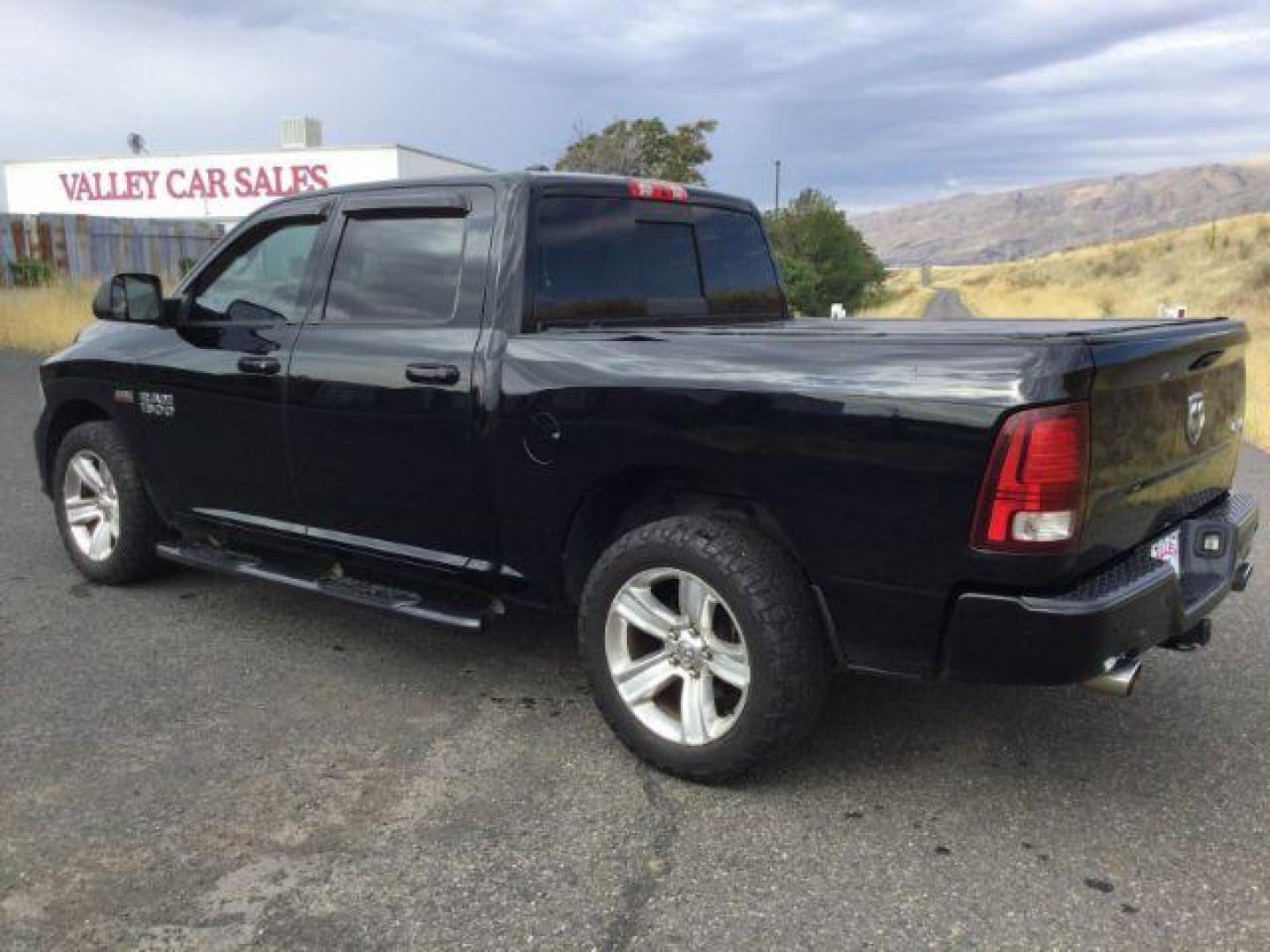 2014 Black Clearcoat /Black RAM 1500 Sport Crew Cab SWB 4WD (1C6RR7MT4ES) with an 5.7L V8 OHV 16V engine, 8-Speed Automatic transmission, located at 1801 Main Street, Lewiston, 83501, (208) 743-9371, 46.417065, -117.004799 - Photo#2