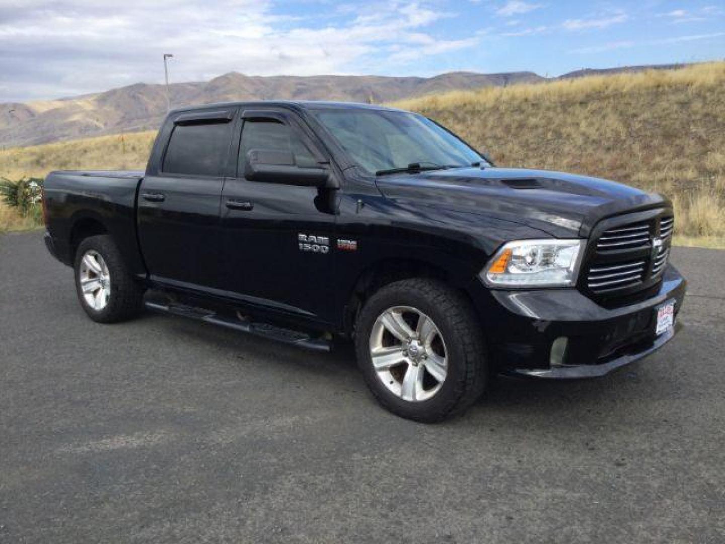 2014 Black Clearcoat /Black RAM 1500 Sport Crew Cab SWB 4WD (1C6RR7MT4ES) with an 5.7L V8 OHV 16V engine, 8-Speed Automatic transmission, located at 1801 Main Street, Lewiston, 83501, (208) 743-9371, 46.417065, -117.004799 - Photo#8