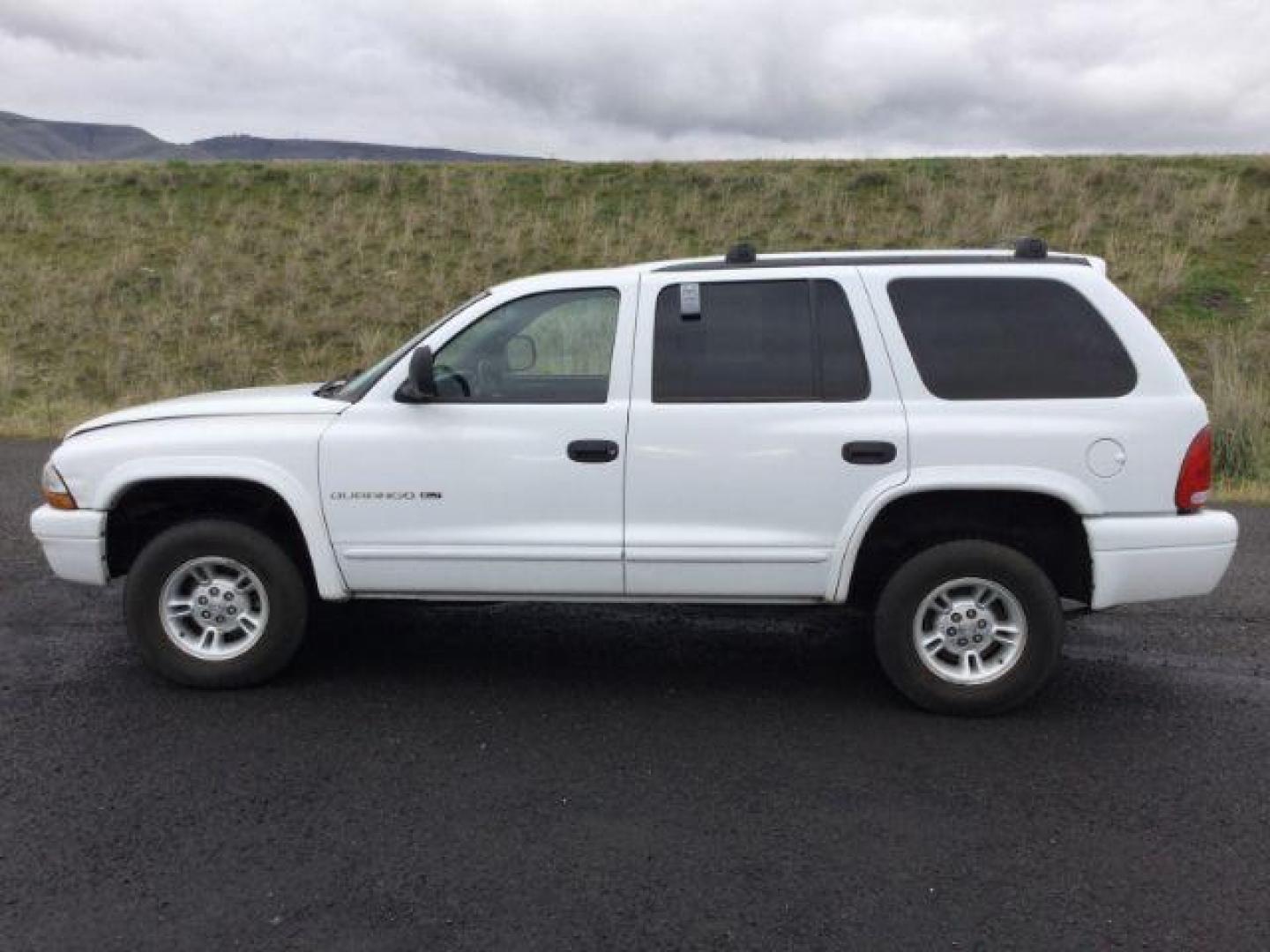 1999 Bright White Clear Coat /black leather Dodge Durango 4WD (1B4HS28Y6XF) with an 5.2L V8 OHV 16V engine, 4-Speed Automatic transmission, located at 1801 Main Street, Lewiston, 83501, (208) 743-9371, 46.417065, -117.004799 - Photo#1