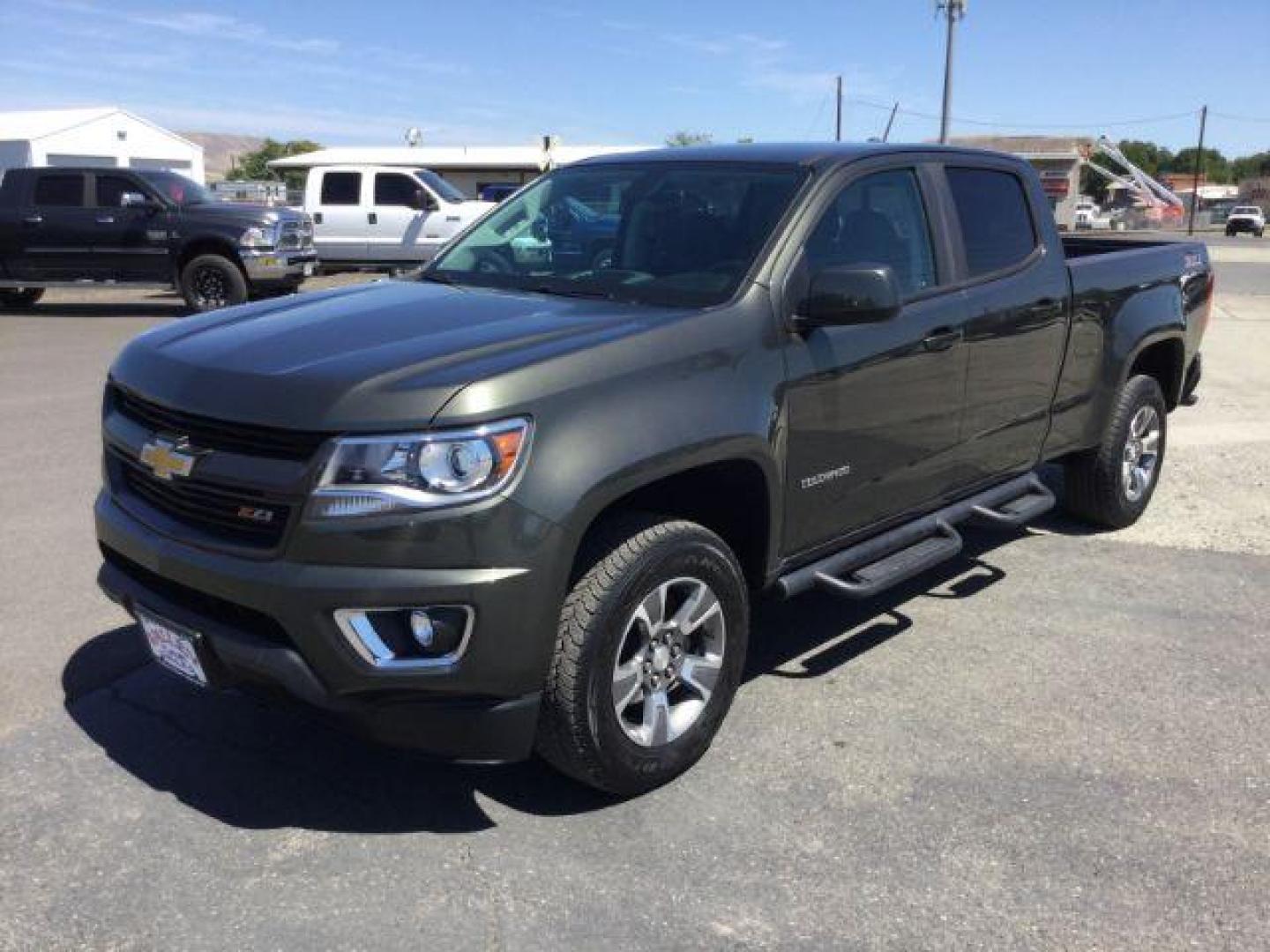 2018 Deepwood Green Metallic /Jet Black, leatherette/cloth Chevrolet Colorado Z71 Crew Cab 4WD Long Box (1GCGTDEN8J1) with an 3.6L V6 DOHC 24V GAS engine, 6-Speed Automatic transmission, located at 1801 Main Street, Lewiston, 83501, (208) 743-9371, 46.417065, -117.004799 - Photo#0