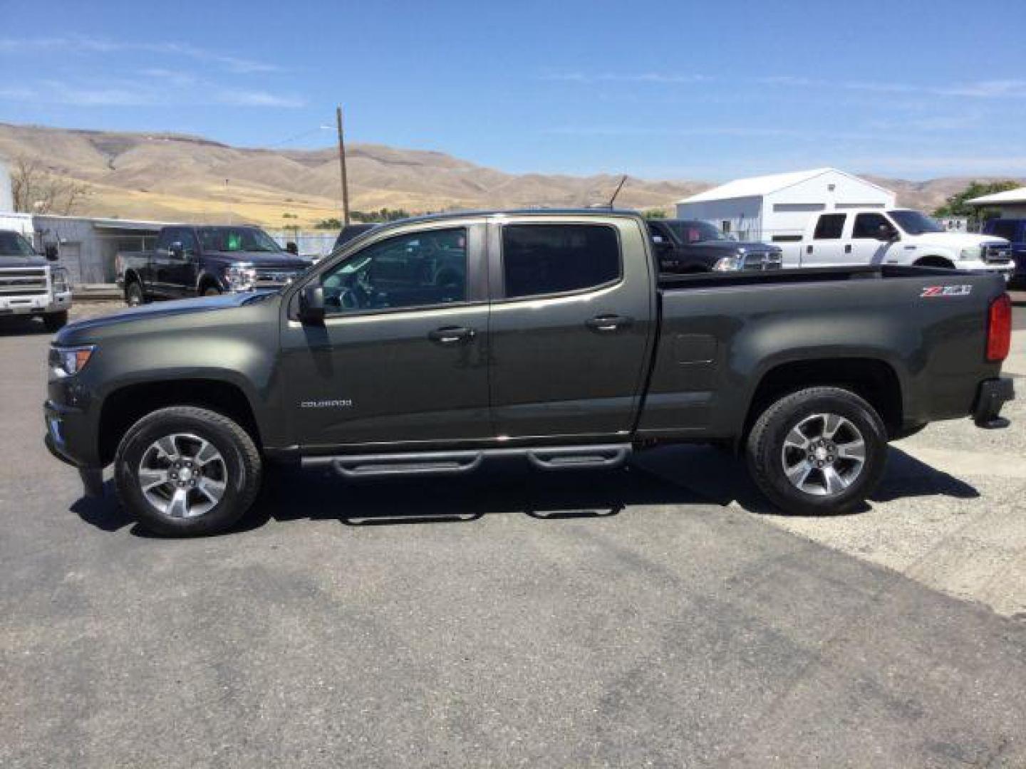 2018 Deepwood Green Metallic /Jet Black, leatherette/cloth Chevrolet Colorado Z71 Crew Cab 4WD Long Box (1GCGTDEN8J1) with an 3.6L V6 DOHC 24V GAS engine, 6-Speed Automatic transmission, located at 1801 Main Street, Lewiston, 83501, (208) 743-9371, 46.417065, -117.004799 - Photo#1