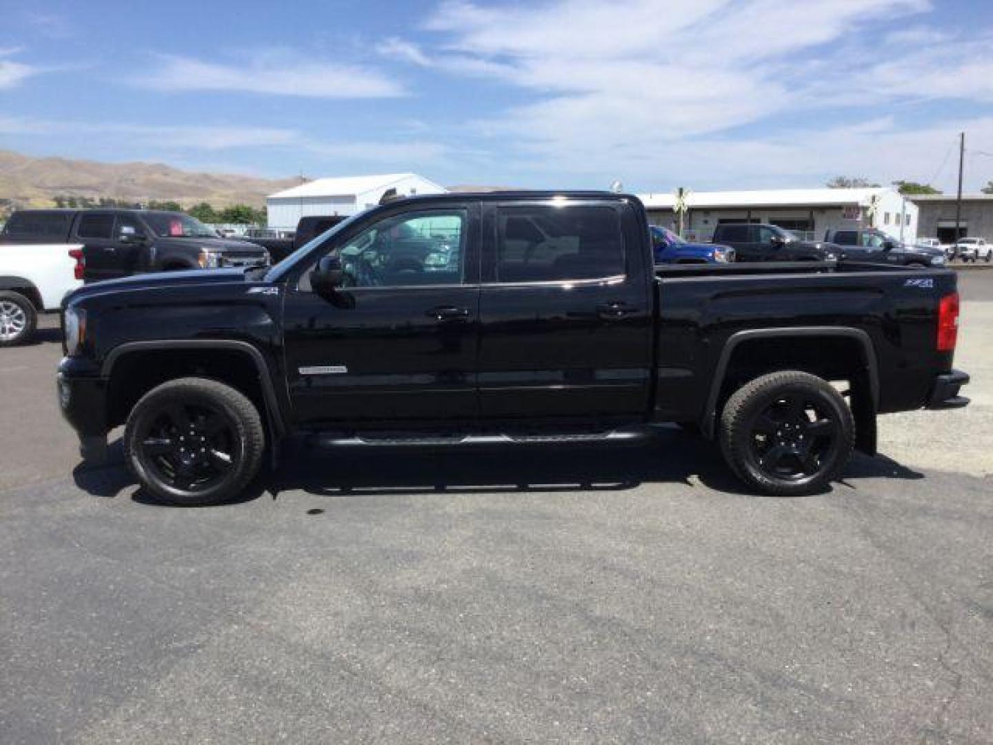 2017 Onyx Black /Dark Ash Seats w/Jet Black Interior Accents, cloth GMC Sierra 1500 SLE Crew Cab Short Box 4WD (3GTU2MEC1HG) with an 5.3L V8 OHV 16V engine, 6-Speed Automatic transmission, located at 1801 Main Street, Lewiston, 83501, (208) 743-9371, 46.417065, -117.004799 - Photo#1