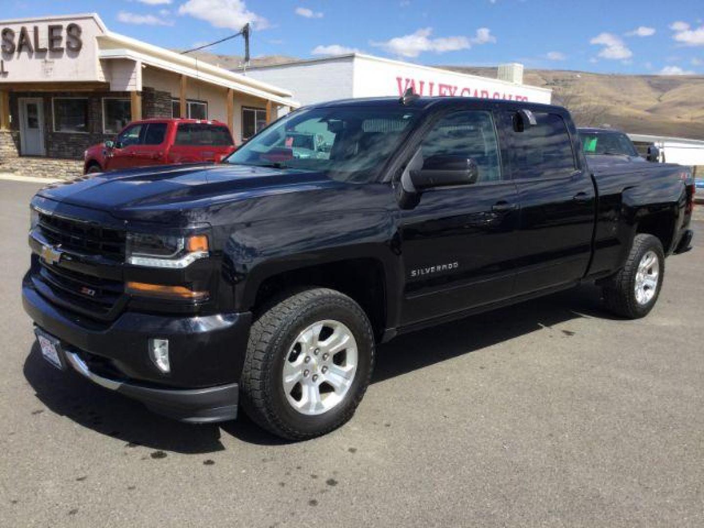 2018 Black /Jet Black, leather Chevrolet Silverado 1500 LT Crew Cab Long Box 4WD (1GCUKREC9JF) with an 5.3L V8 OHV 16V engine, 6-Speed Automatic transmission, located at 1801 Main Street, Lewiston, 83501, (208) 743-9371, 46.417065, -117.004799 - Photo#0