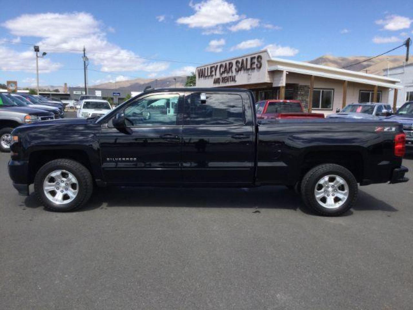 2018 Black /Jet Black, leather Chevrolet Silverado 1500 LT Crew Cab Long Box 4WD (1GCUKREC9JF) with an 5.3L V8 OHV 16V engine, 6-Speed Automatic transmission, located at 1801 Main Street, Lewiston, 83501, (208) 743-9371, 46.417065, -117.004799 - Photo#1