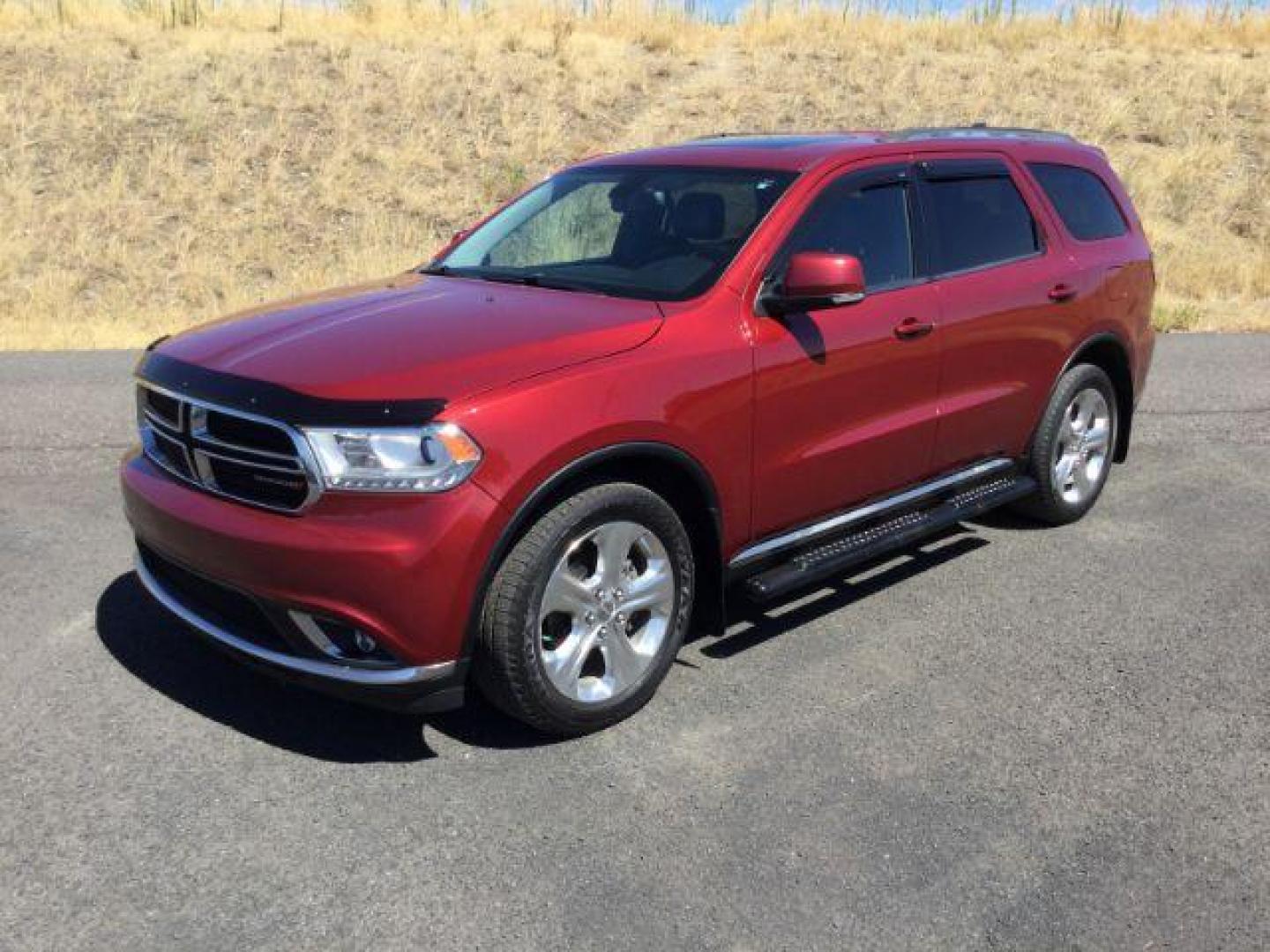 2014 Dp Cherry Red Crystal PC /Black Dodge Durango Limited AWD (1C4RDJDG8EC) with an 3.6L V6 DOHC 24V engine, 8-Speed Automatic transmission, located at 1801 Main Street, Lewiston, 83501, (208) 743-9371, 46.417065, -117.004799 - Photo#0