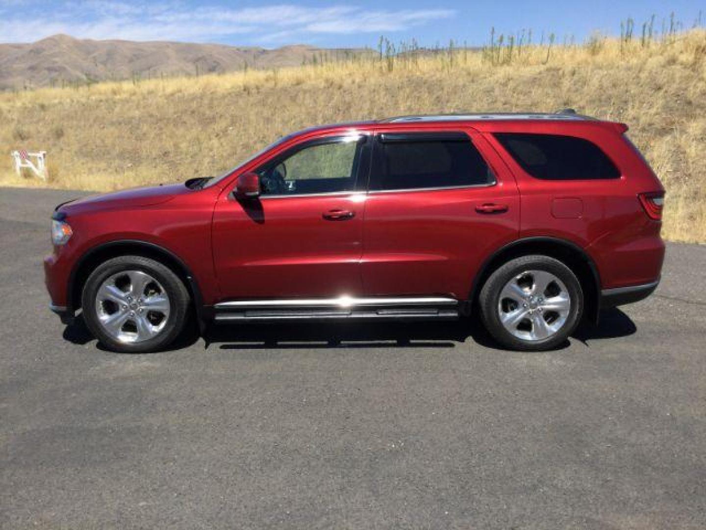 2014 Dp Cherry Red Crystal PC /Black Dodge Durango Limited AWD (1C4RDJDG8EC) with an 3.6L V6 DOHC 24V engine, 8-Speed Automatic transmission, located at 1801 Main Street, Lewiston, 83501, (208) 743-9371, 46.417065, -117.004799 - Photo#1