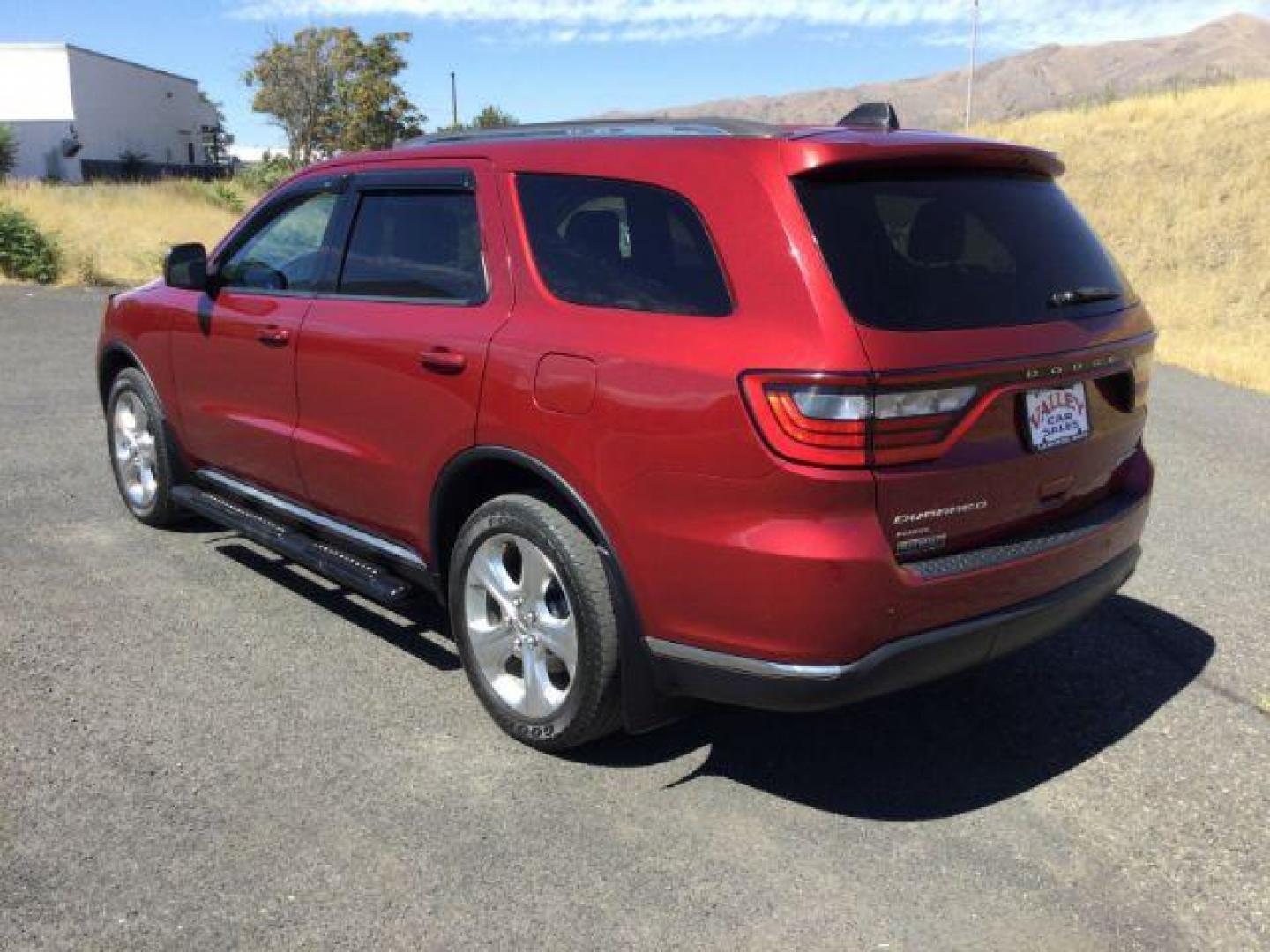 2014 Dp Cherry Red Crystal PC /Black Dodge Durango Limited AWD (1C4RDJDG8EC) with an 3.6L V6 DOHC 24V engine, 8-Speed Automatic transmission, located at 1801 Main Street, Lewiston, 83501, (208) 743-9371, 46.417065, -117.004799 - Photo#2