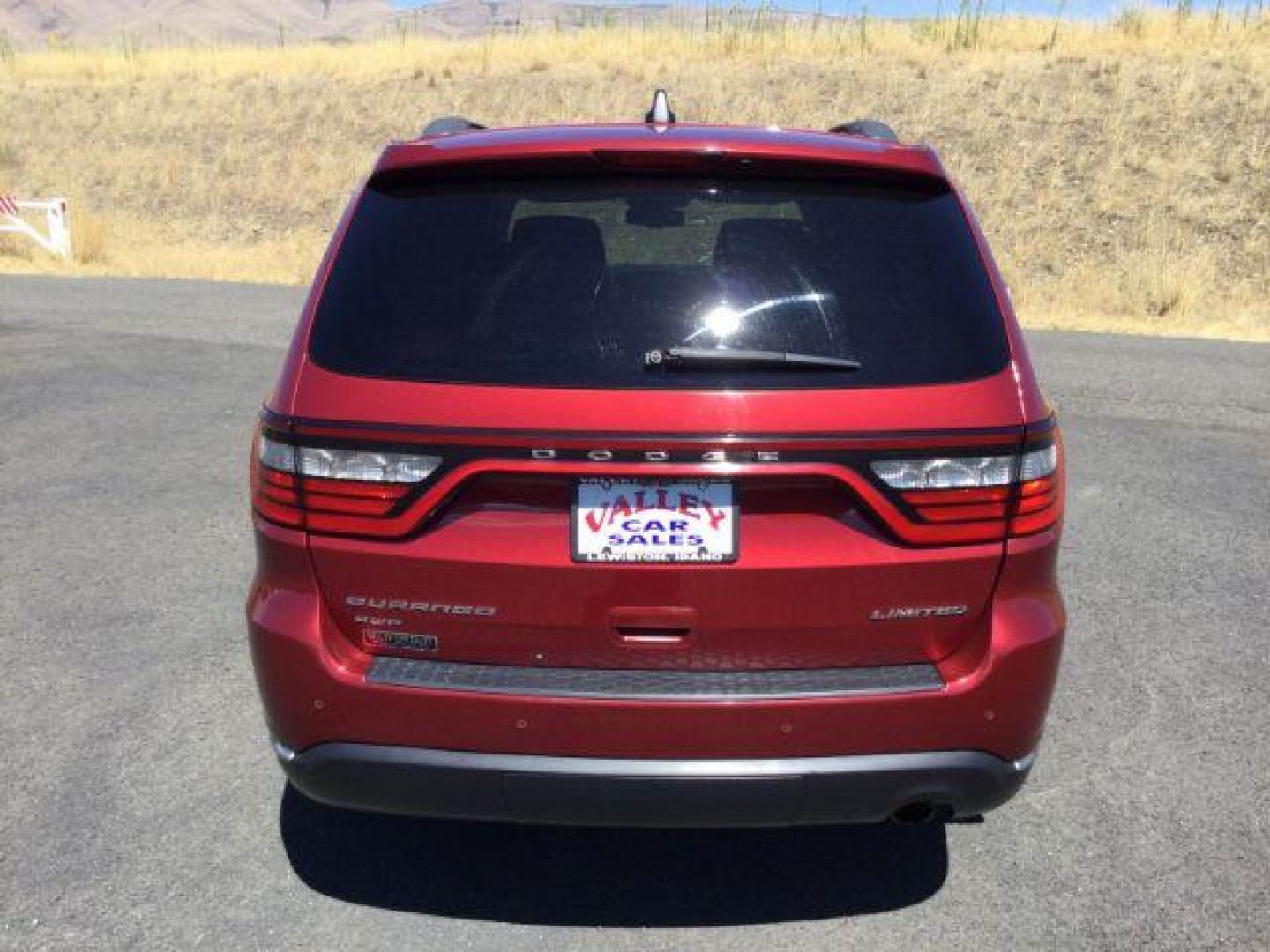 2014 Dp Cherry Red Crystal PC /Black Dodge Durango Limited AWD (1C4RDJDG8EC) with an 3.6L V6 DOHC 24V engine, 8-Speed Automatic transmission, located at 1801 Main Street, Lewiston, 83501, (208) 743-9371, 46.417065, -117.004799 - Photo#3